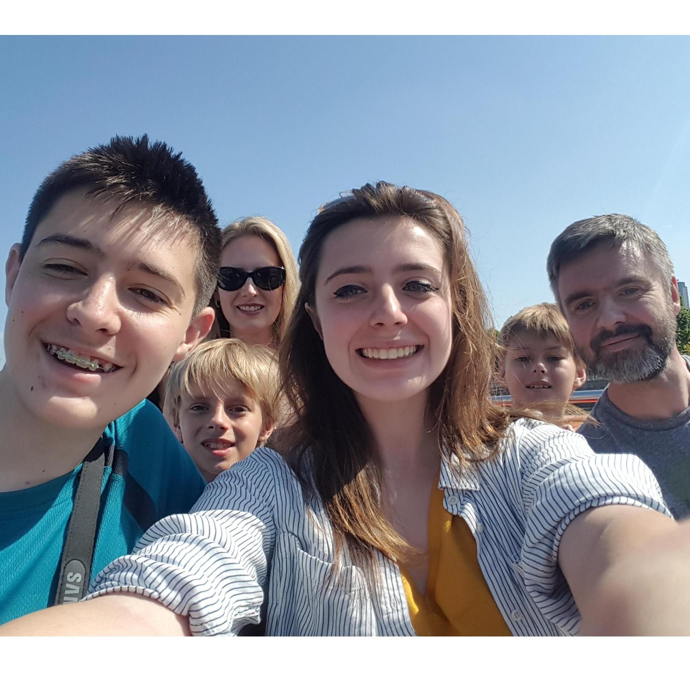 Family boat tour on the River Thames, London, England