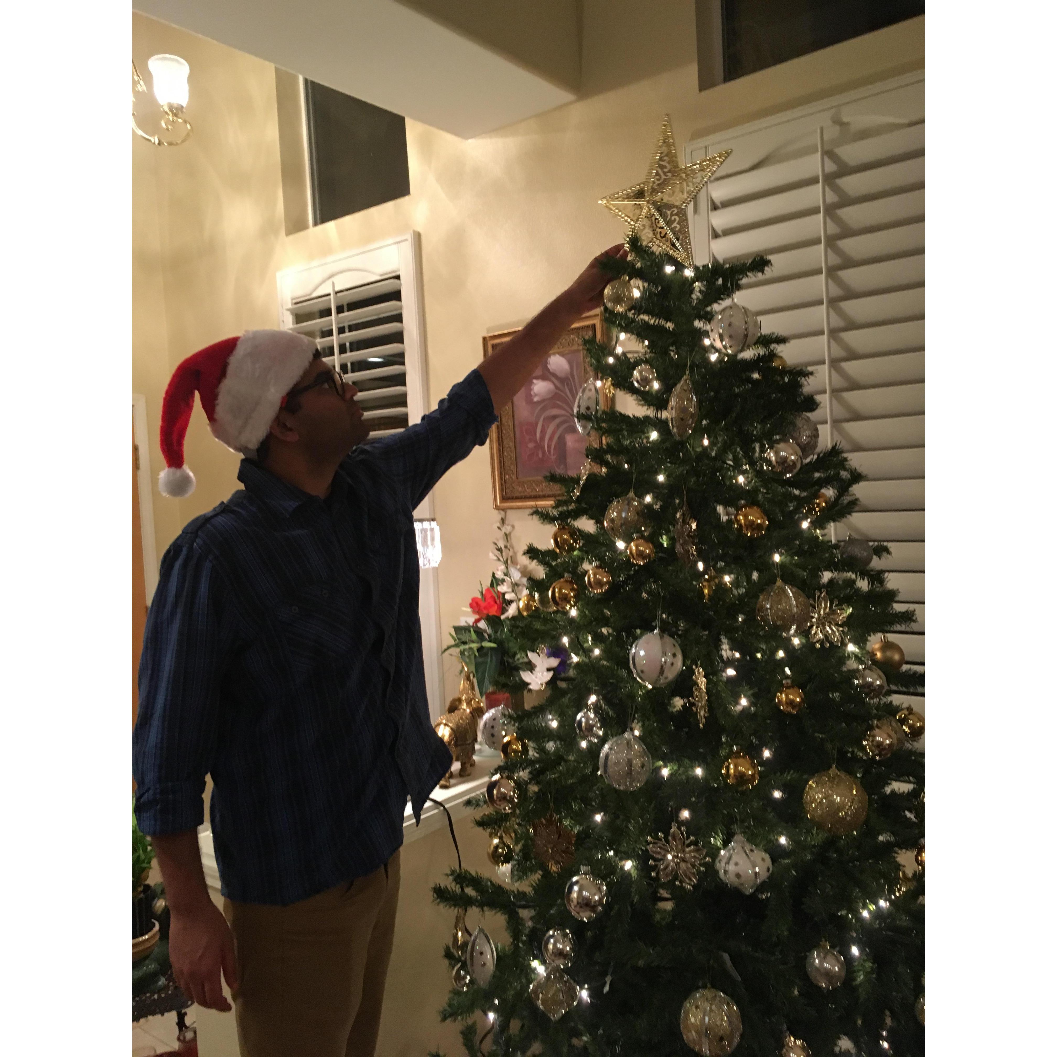 Sumedh can reach the tops of Christmas trees, bonus!