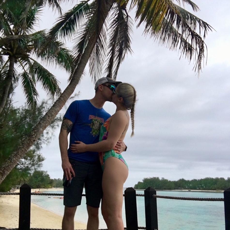 Two days before Ajay proposed in the Cook islands. He proposed at golden hour on the little motu island that is visible behind us in this photo.