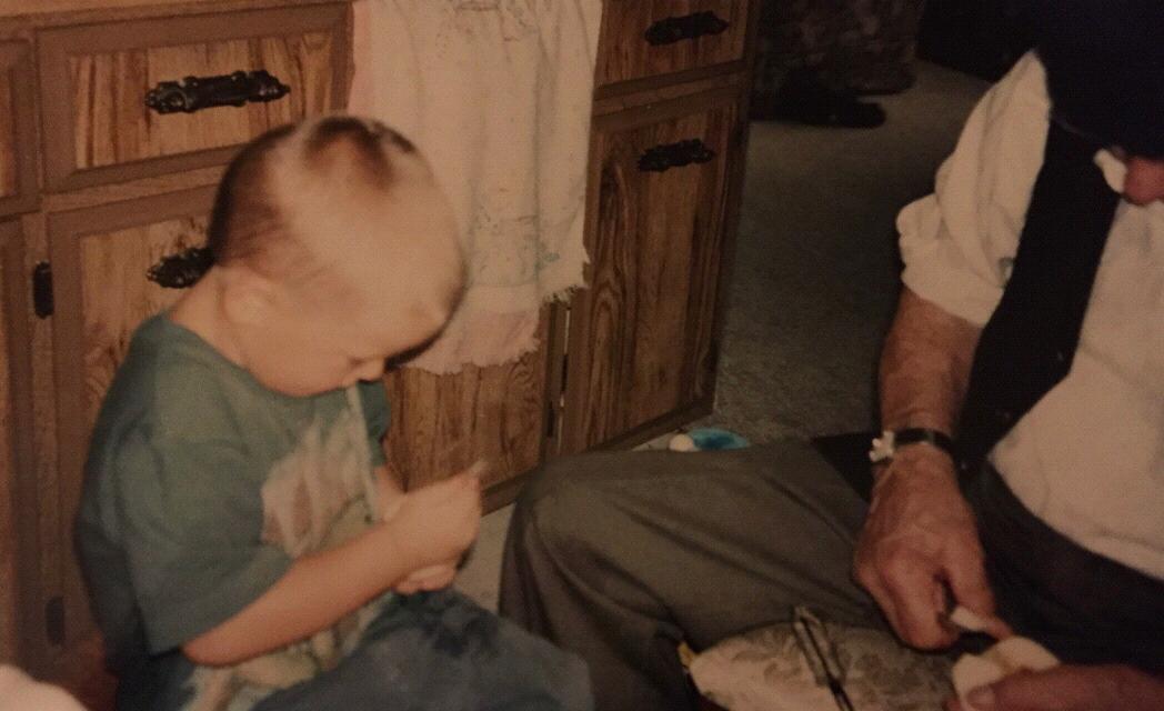 Cody helping Great Grandpa Make applesauce