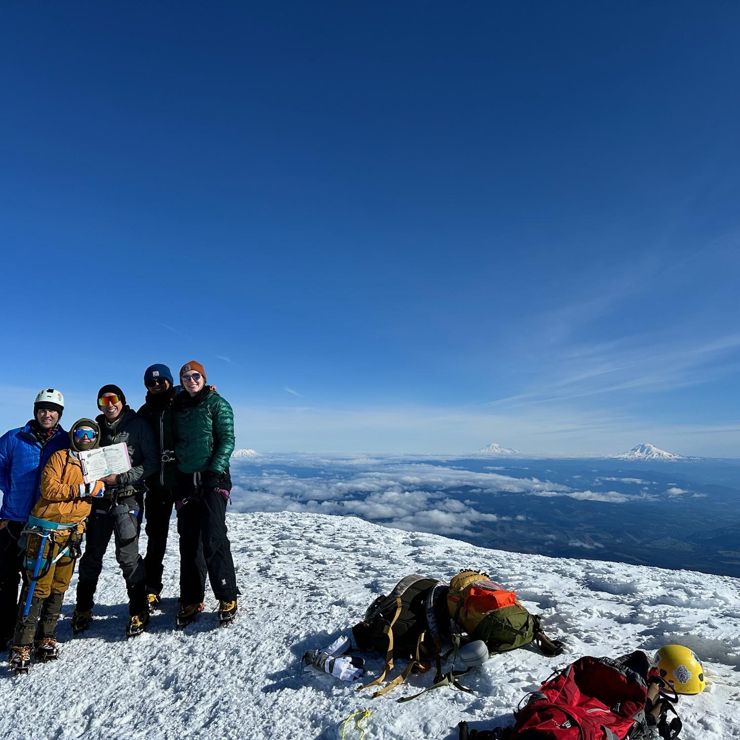 Group photo with the completed certificate. Clear skies, the best views, and high stoke levels