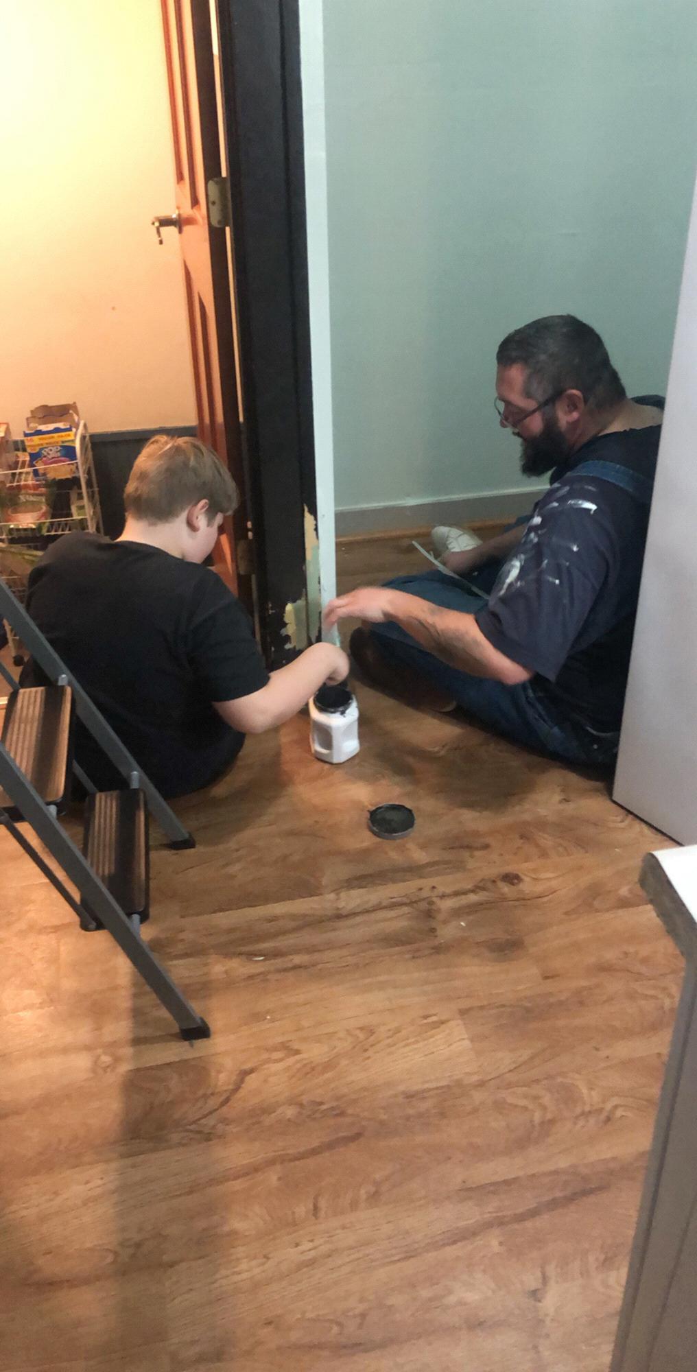 Showing Caleb how to paint