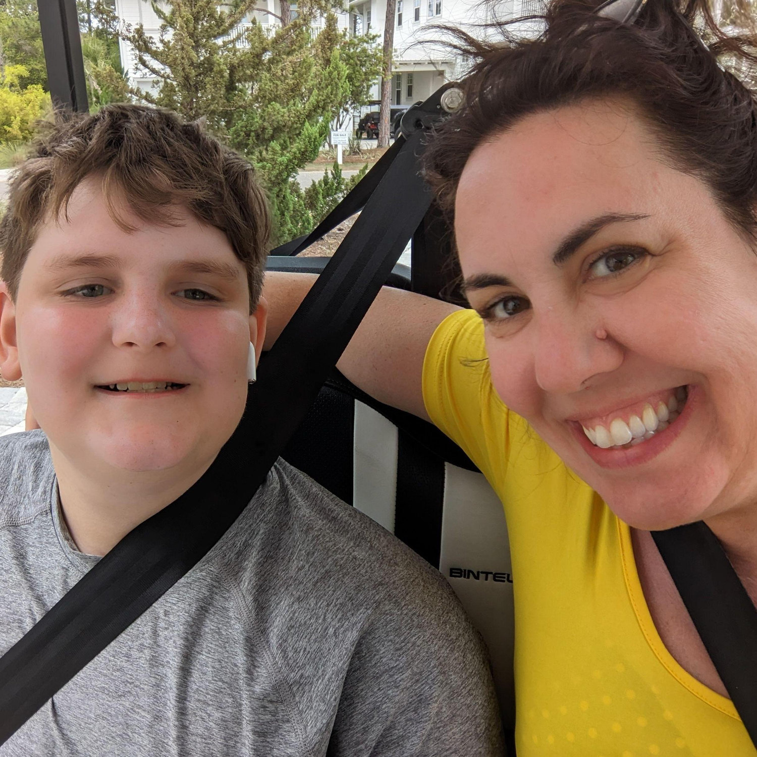 Jack and I hitching a ride on the golf  cart during family trip to Florida