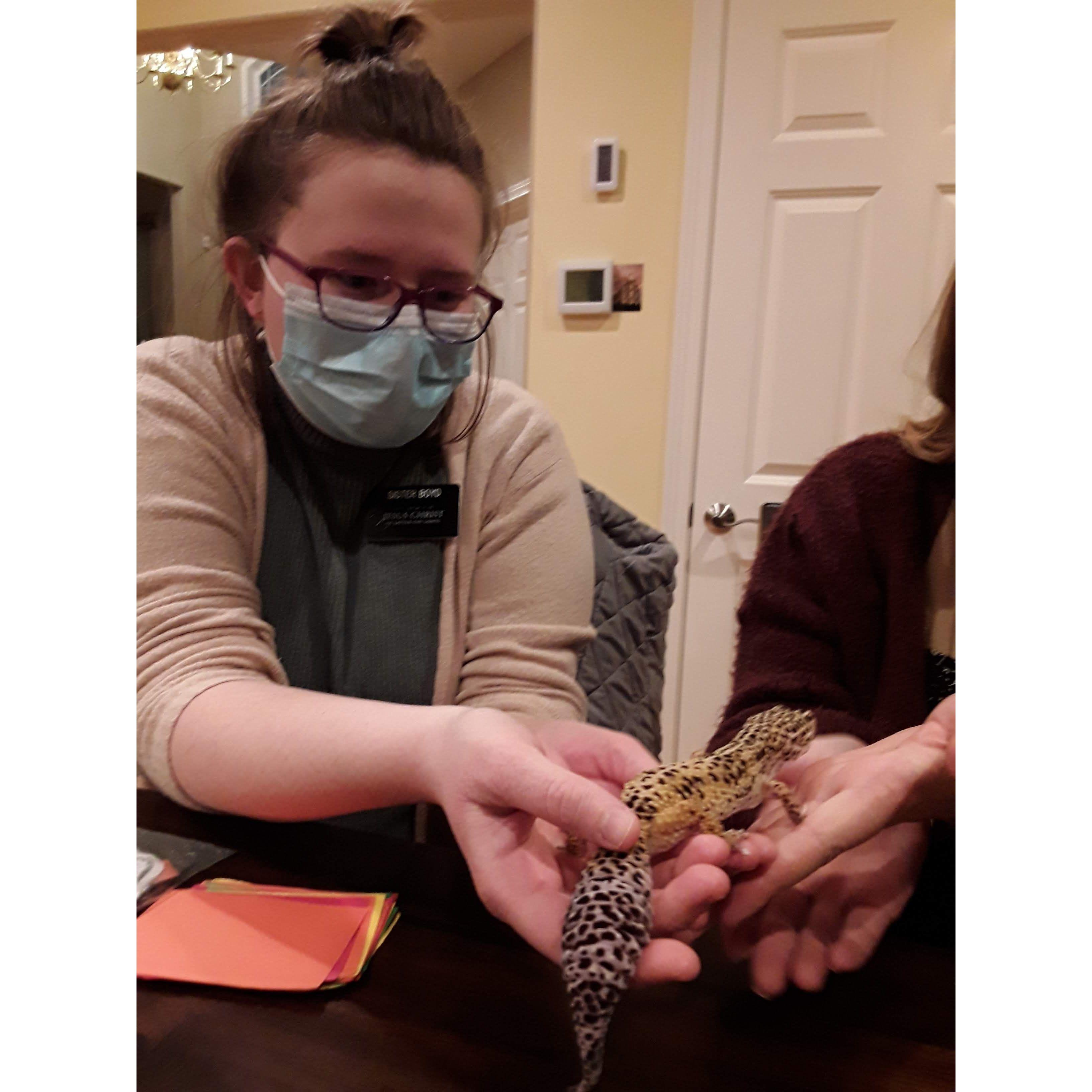 Hannah on her mission in Seattle, WA holding a leopard gecko