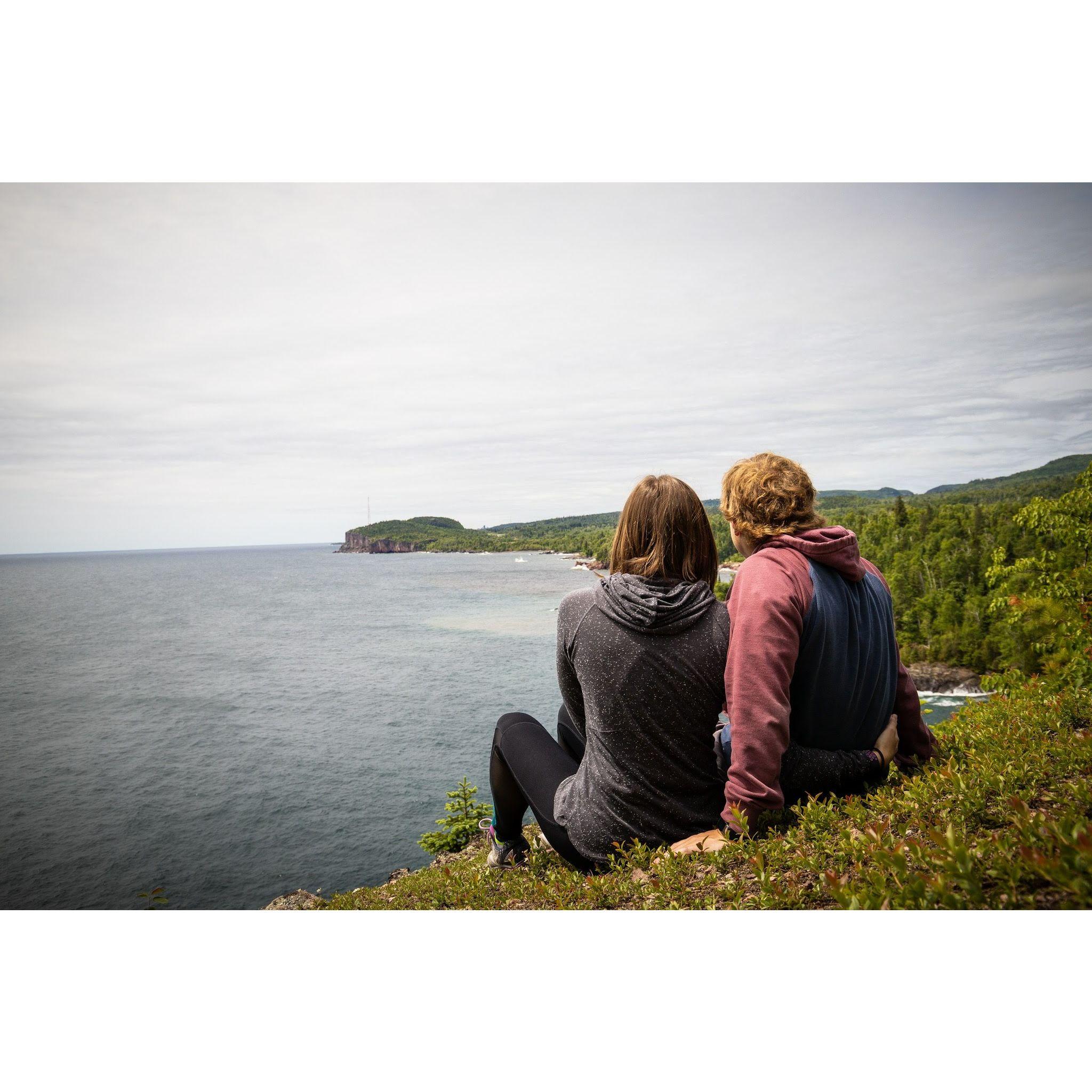 Our first vacation together was spent on the north shore of Lake Superior in 2018. Pictured is the superior shoreline and Palisade Head rock formation in the distance.