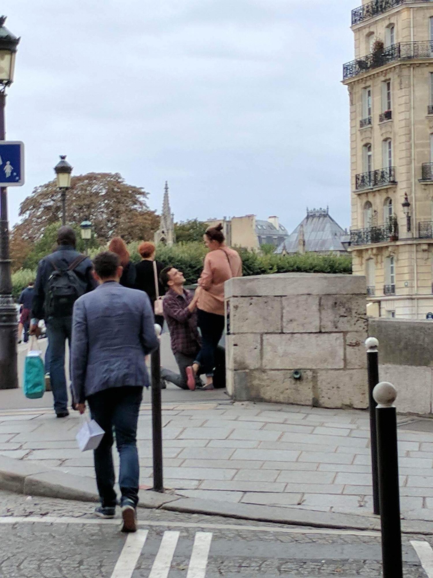 Where he got down on one knee on the St. Louis Bridge (While his buddy secretly took pictures amongst a sea of uninterested Parisians...)