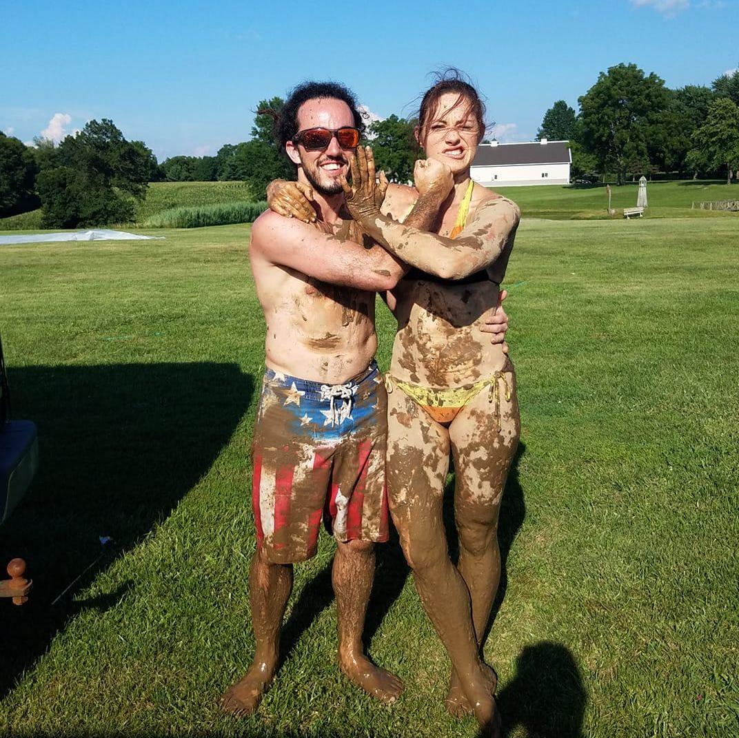 2018: Mud volleyball! When we were just friends at Tad's family's Fourth of July party.