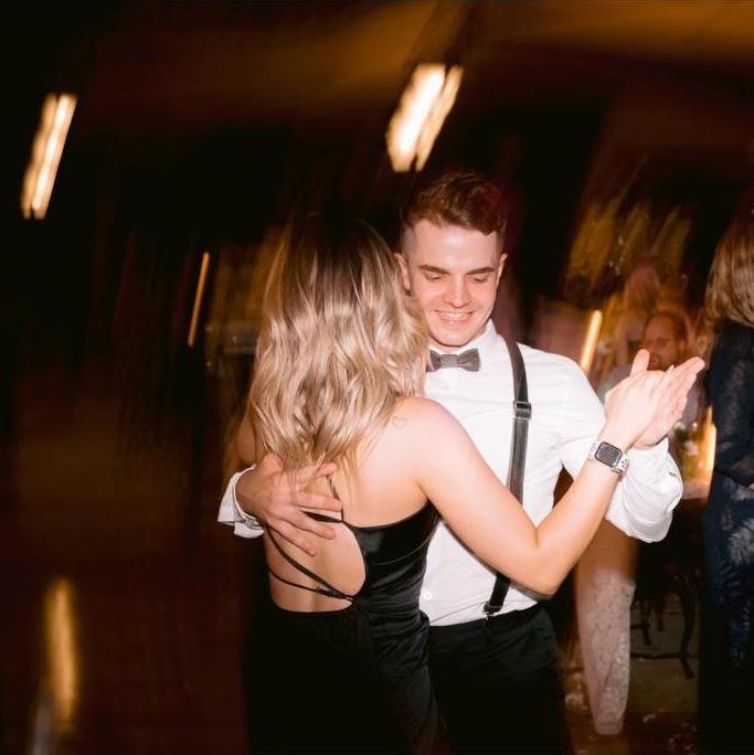 Dancing at our best friends wedding.