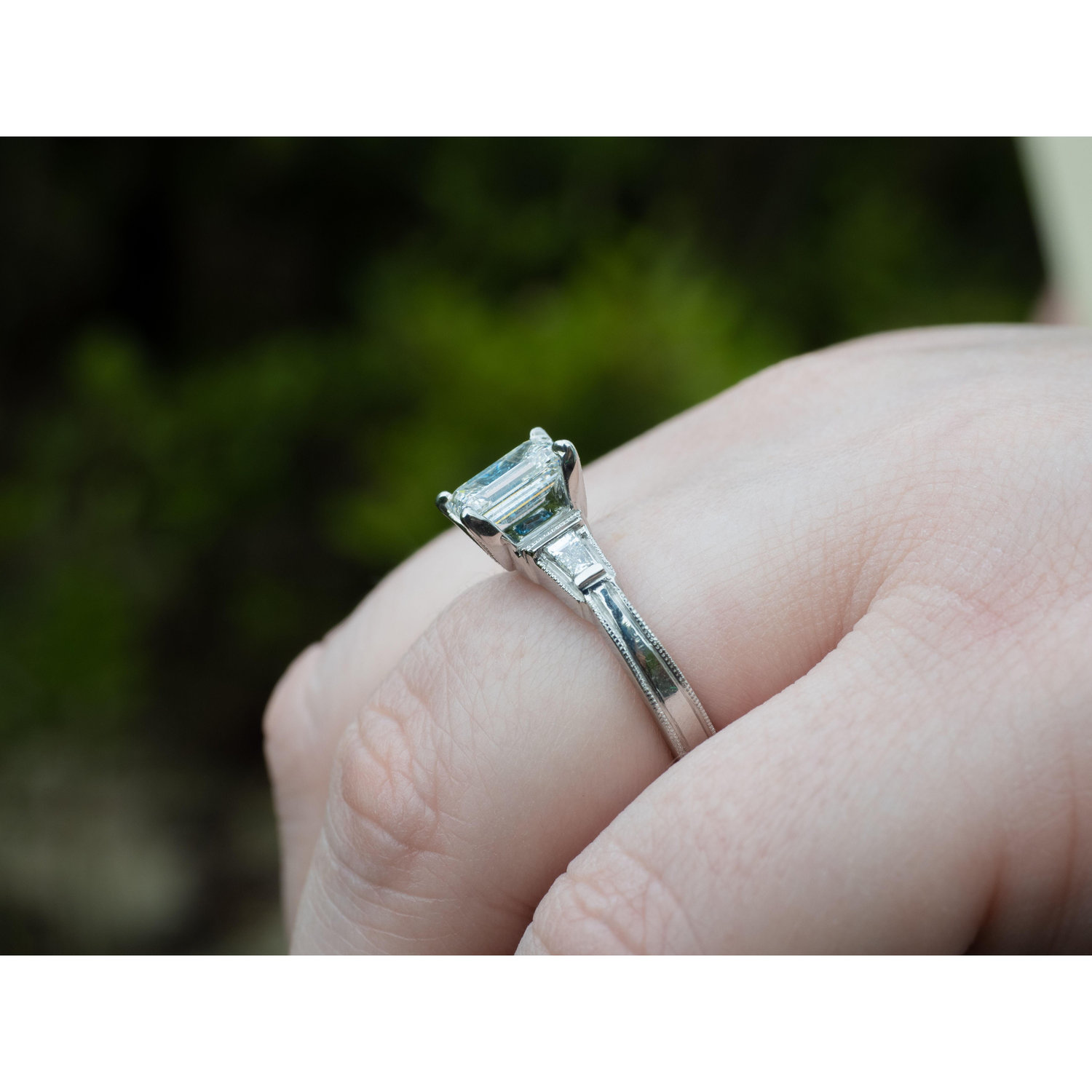 Amanda's engagement ring was set with a blue topaz stone under the center stone, representing both Tim and Amanda's December birthstone.