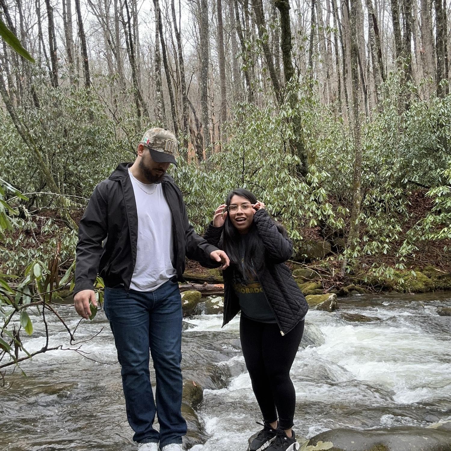 This was me trying to see if we were in frame with the camera 😂We were in Tennessee, and I wanted a cute picture of us by the river. (We were standing on rocks)