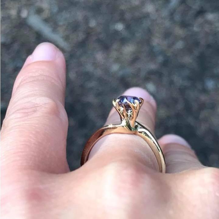 The most perfect, custom ring. Designed by Chase with Leslie in mind, it is a gold band (classic!) in the shape of deer heads with antlers (unique!) with a lavender sapphire (stunning!). Nailed it.