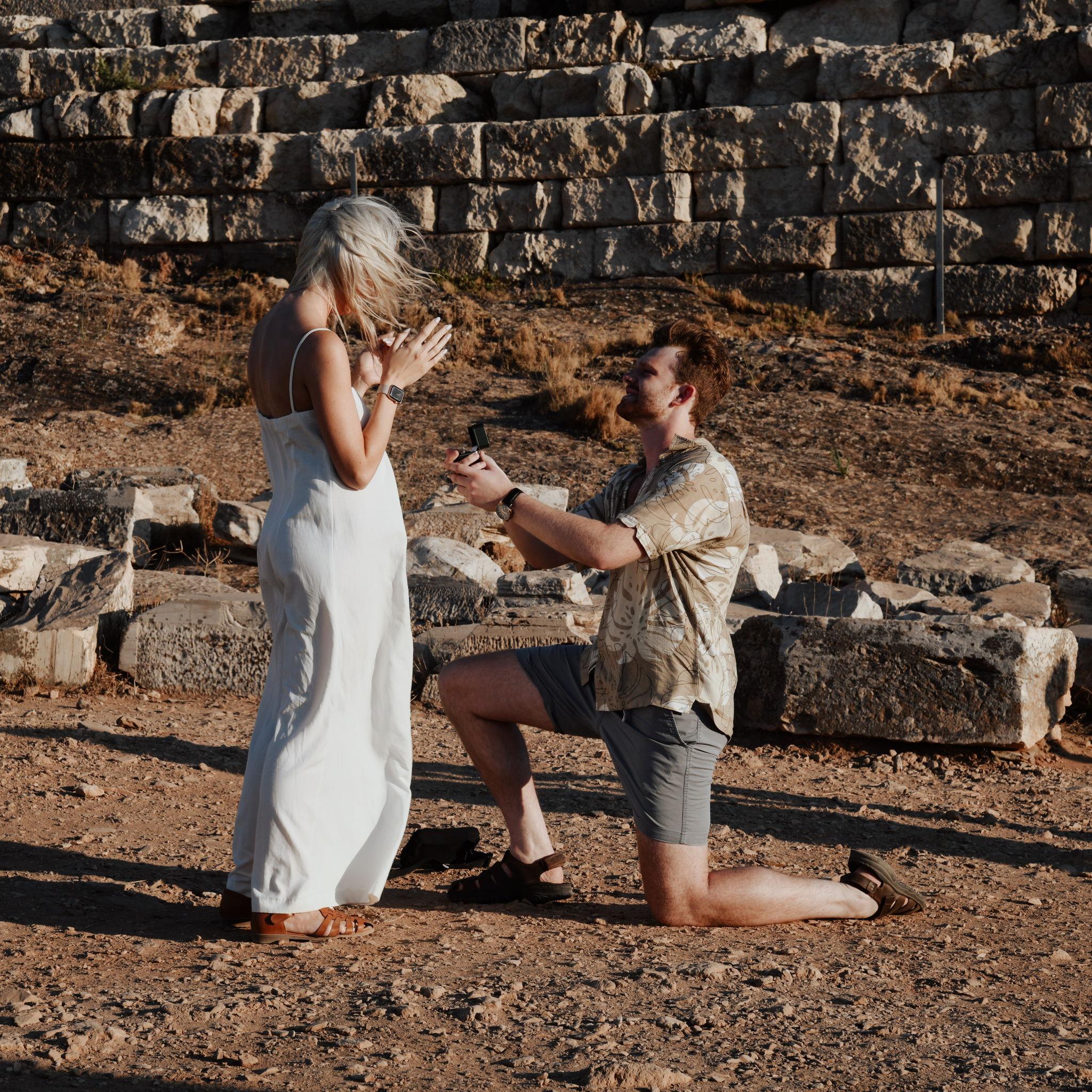 Christian proposed to Victoria as the sun was setting on the Aegean sea at the Temple of Poseidon