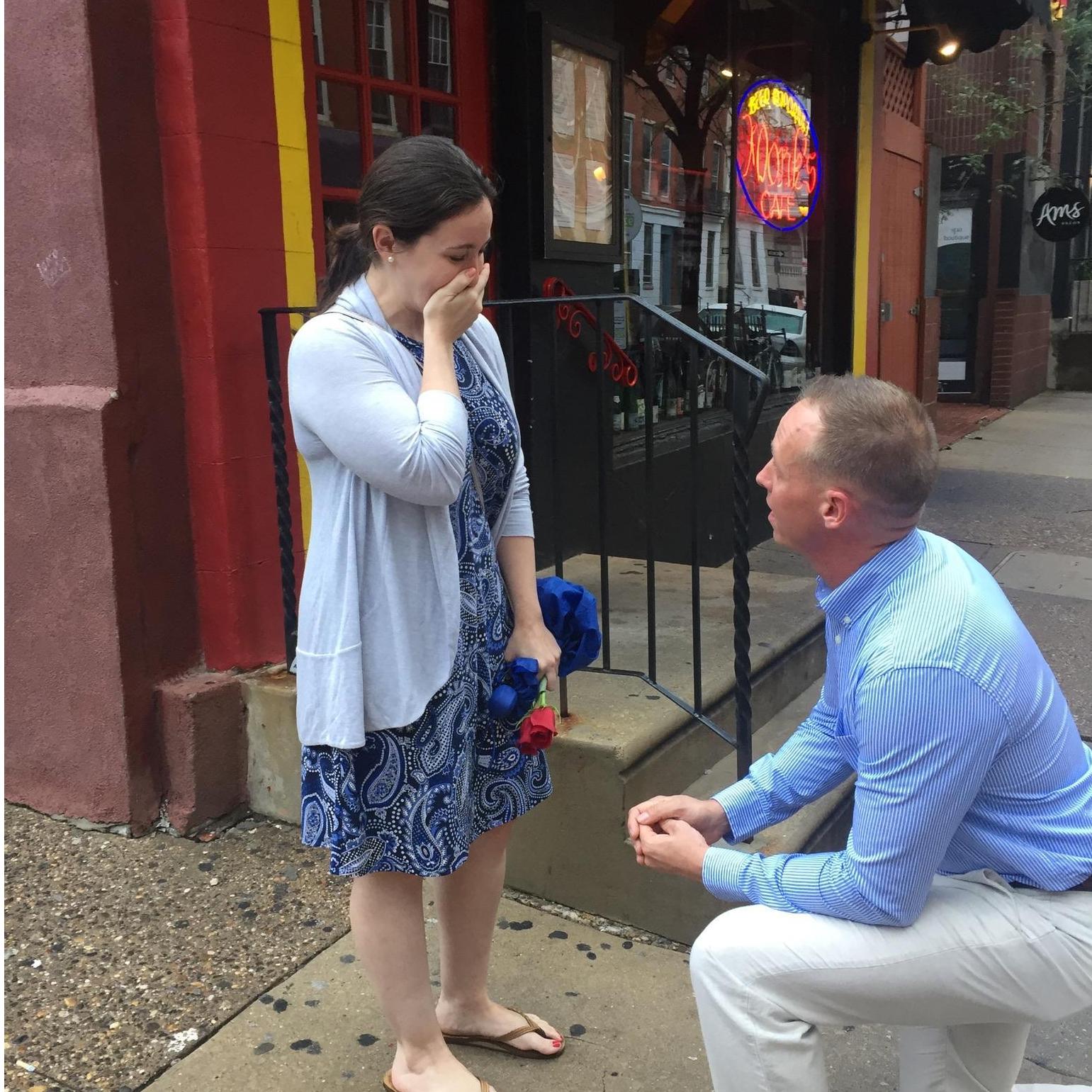 Scott proposing outside Monk's, where we had our first date.