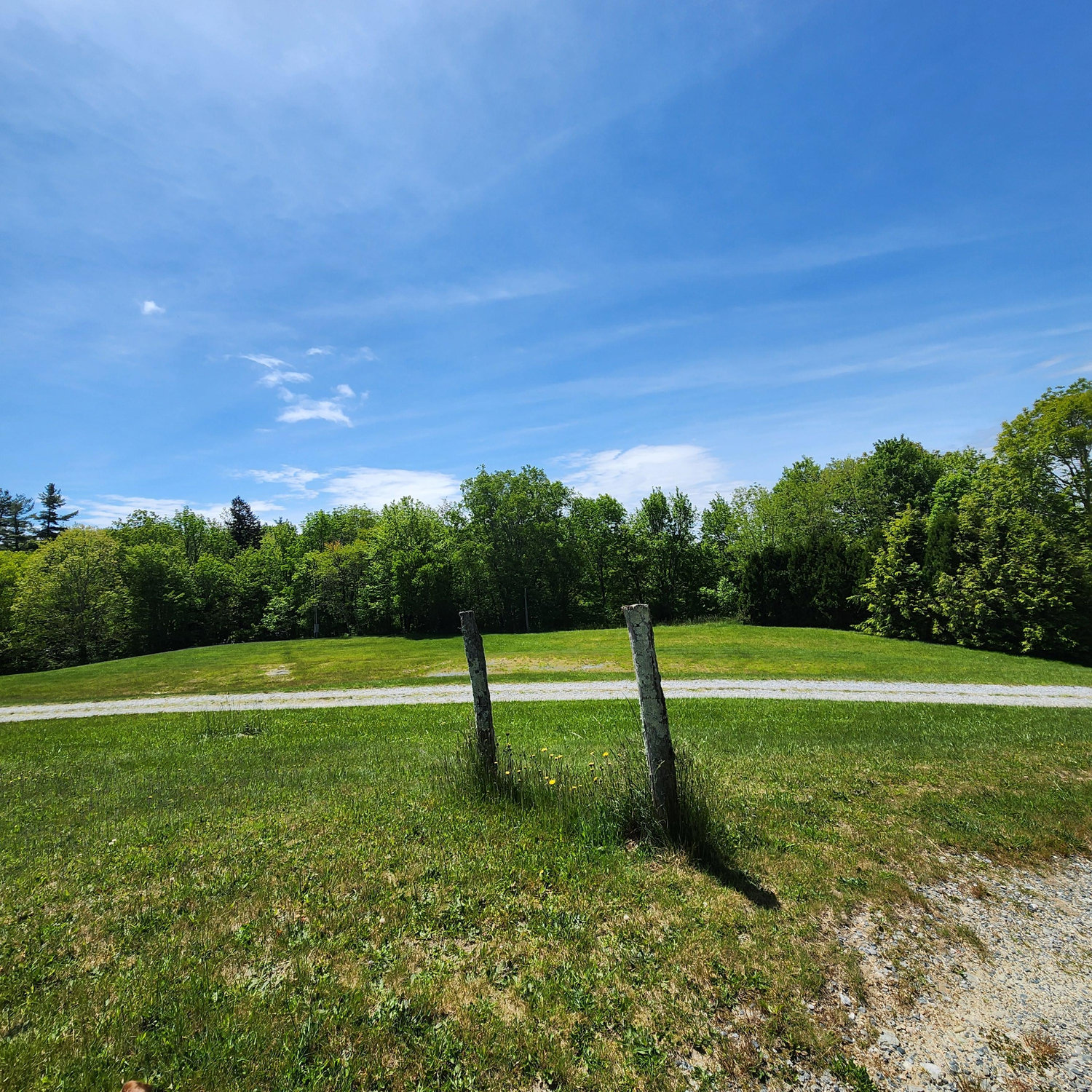 Then we’ll go down a slight hill here toward the reception tent, which will be in the bare-looking spot in the grass in the far background.