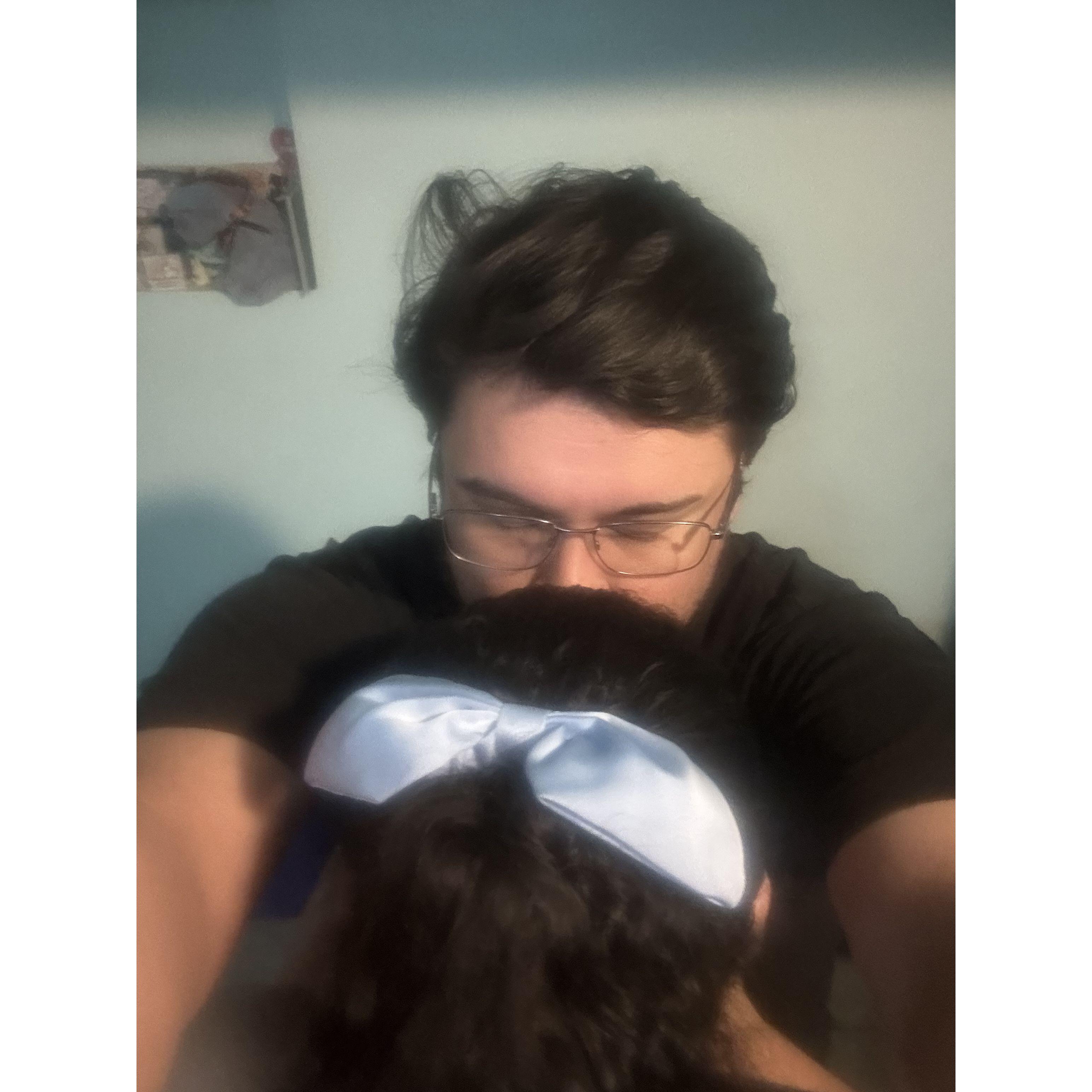 Christian loves giving his woman hair bows and forehead kisses.