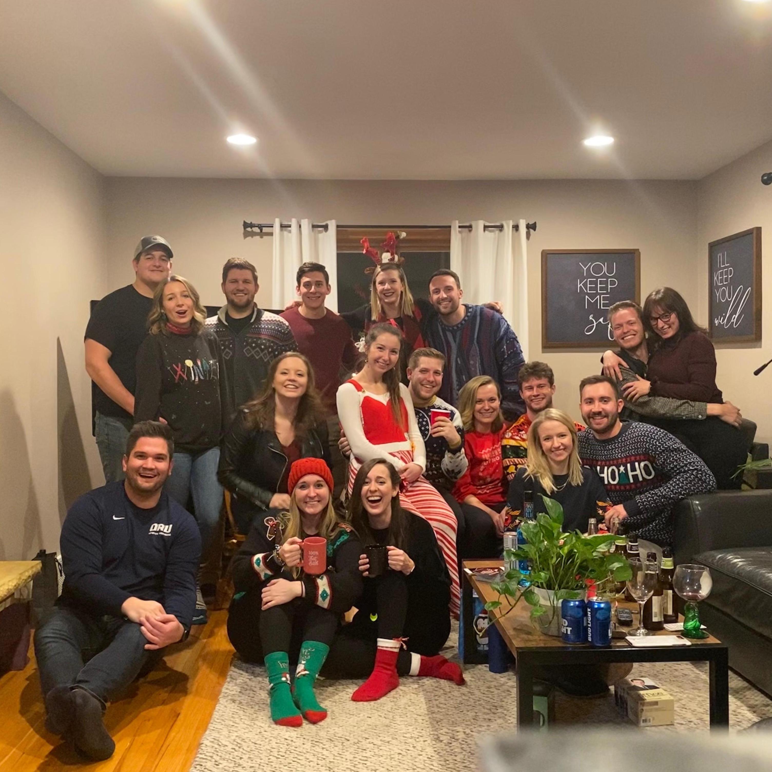 Our very first picture together appropriately includes Joe’s Johnnie/Bennie friends at the annual Christmas Party. Friends like family!