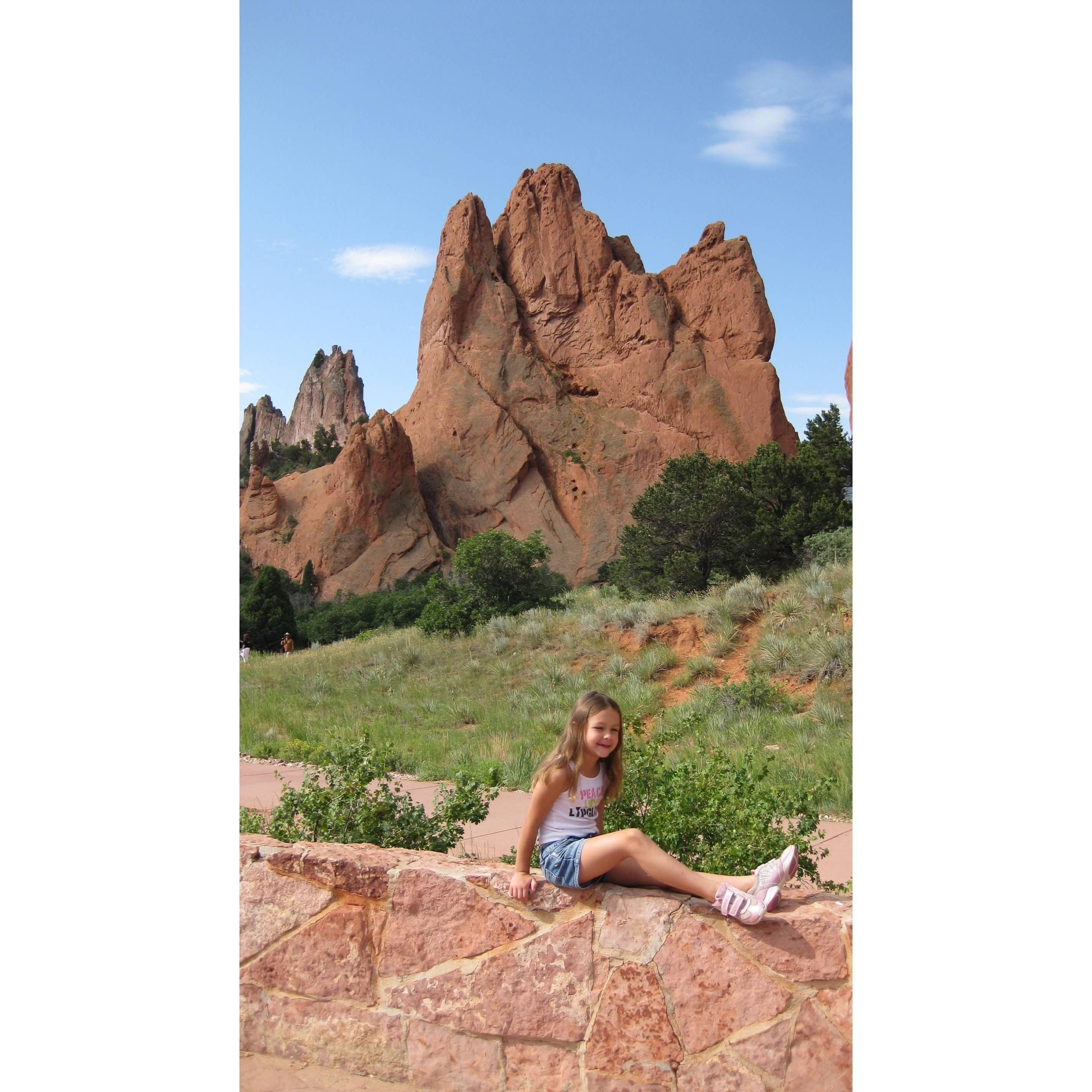 Maddie as a child visiting garden of the gods