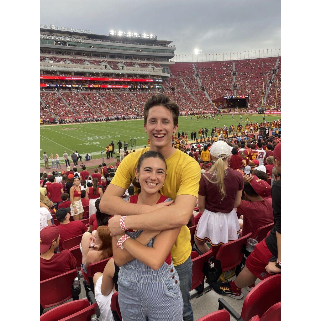 Football games are a great opportunity for Jacob to throw Adeline 8 feet in the air after USC gets a touchdown.