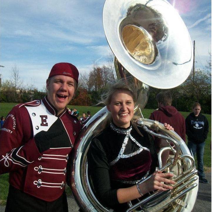Teaching me how to hold a sousaphone