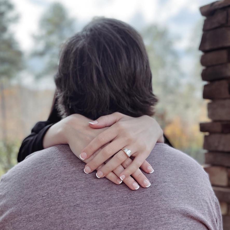 We're engaged! Josh proposed November 4, 2022. We don't have any proposal photos as we kept the moment between the two of us and very personal. He asked me at home next to our Christmas tree.