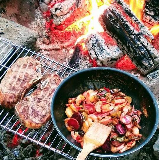 Wooing me with his mad campfire cooking skills!