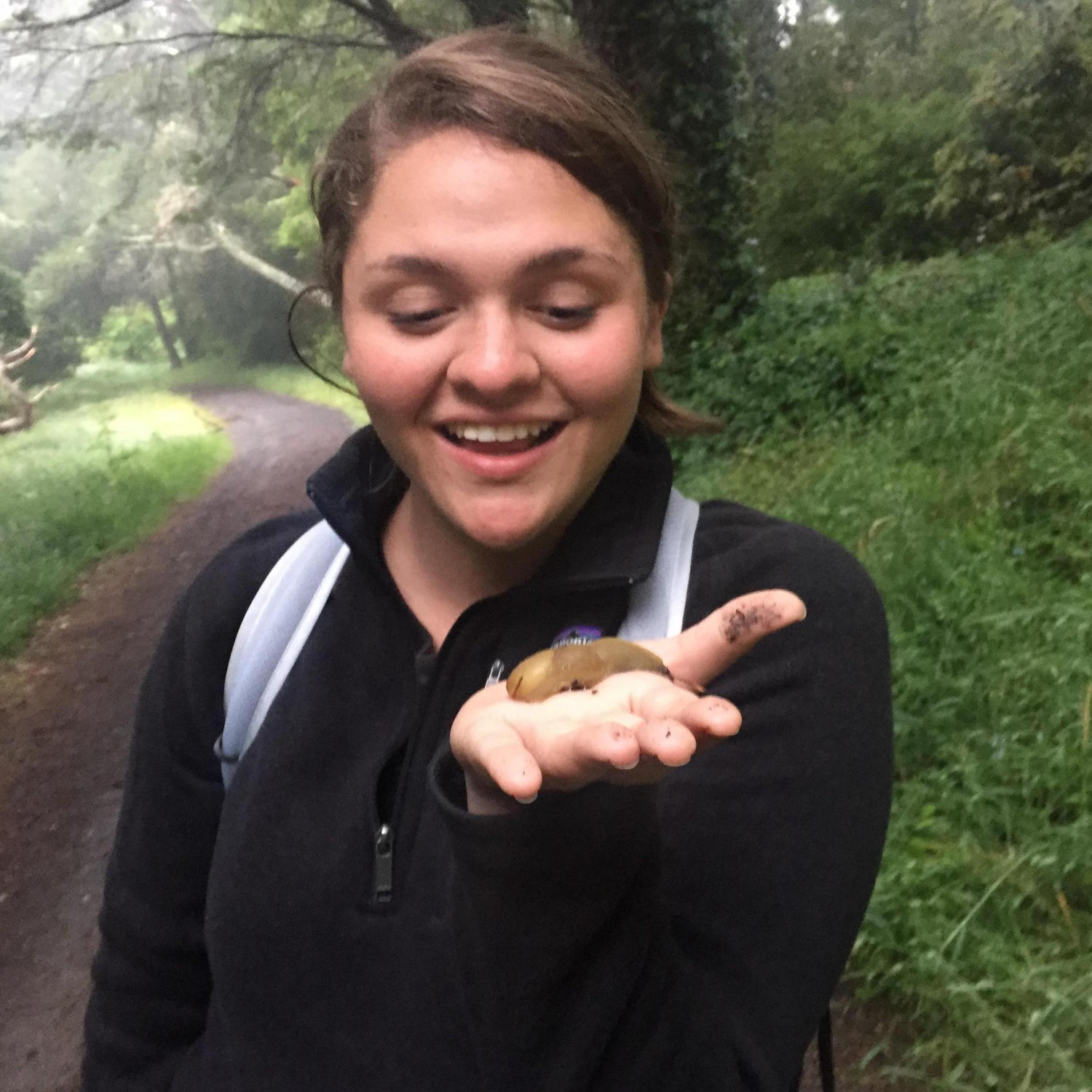 Woman holding a banana slug. Circa 2017.