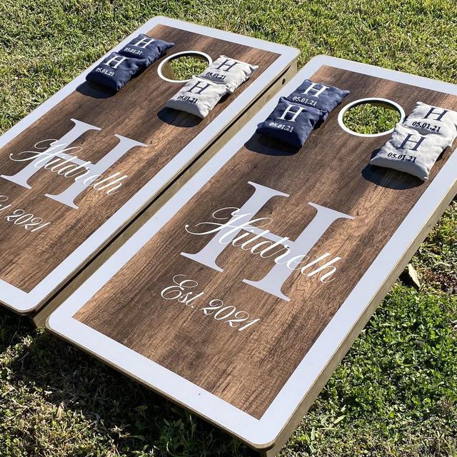 Personalized cornhole boards, embroidered bags, and tote bag