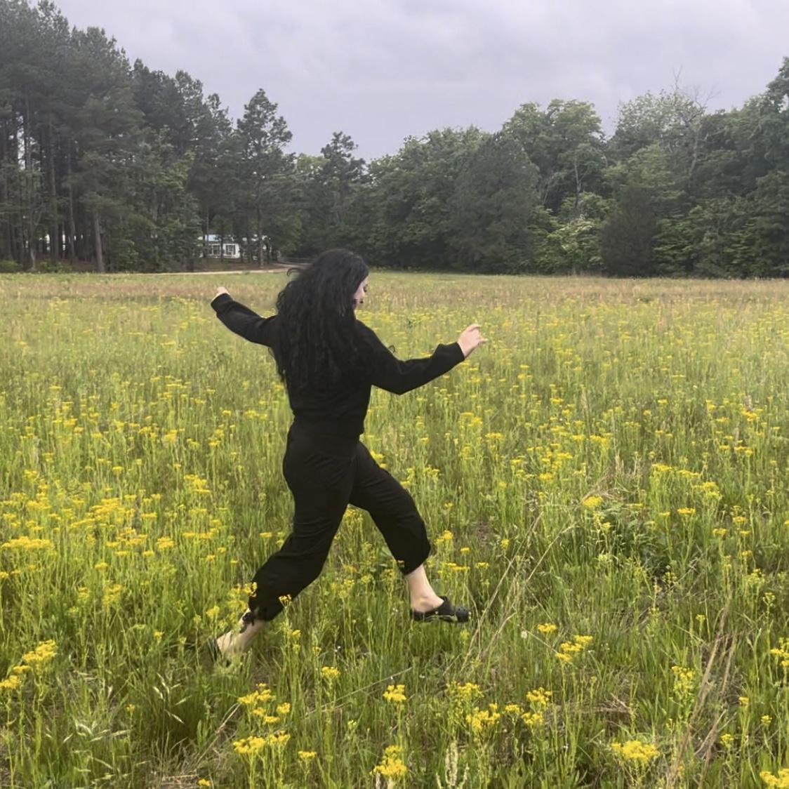 Ani frolicking in a field for the first time. (Raeford, NC)