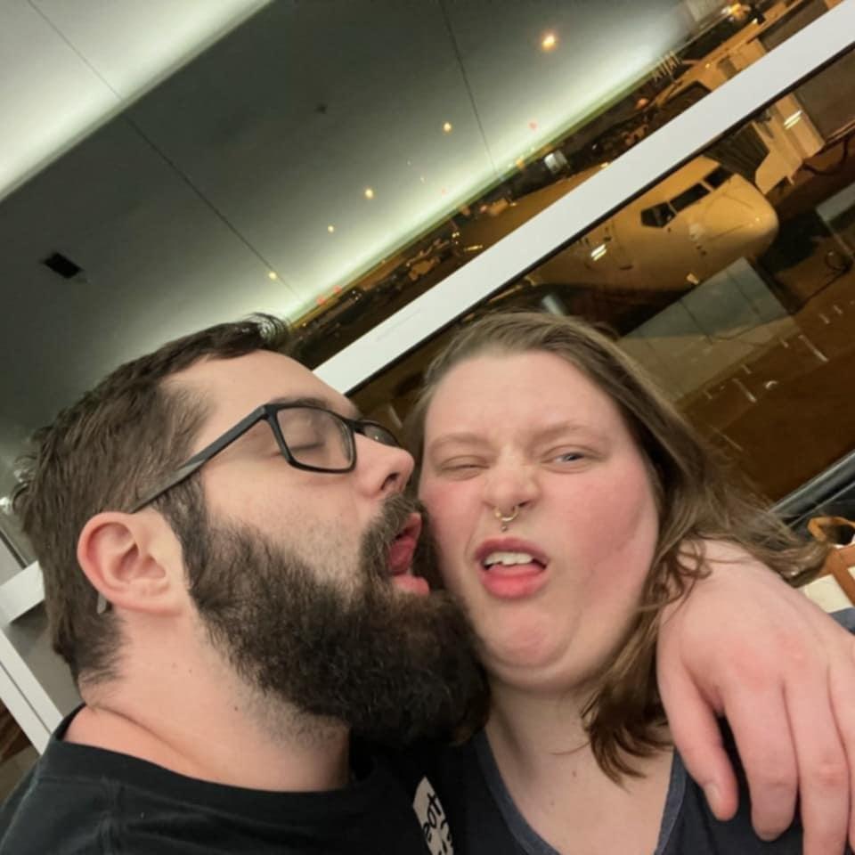 Went in to take a cute pic at the airport with Robert and got greeted with tongue.