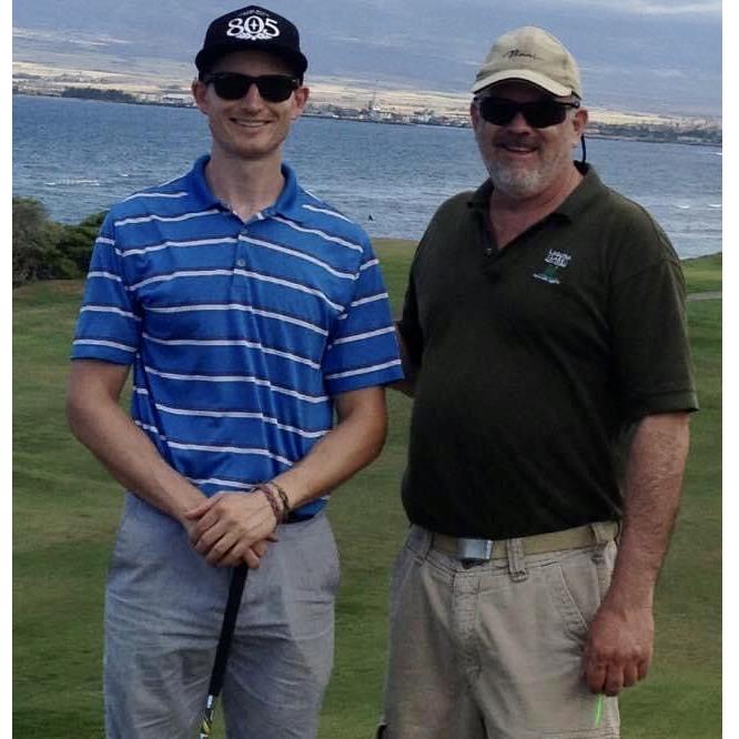 John and his dad playing golf in Hawaii