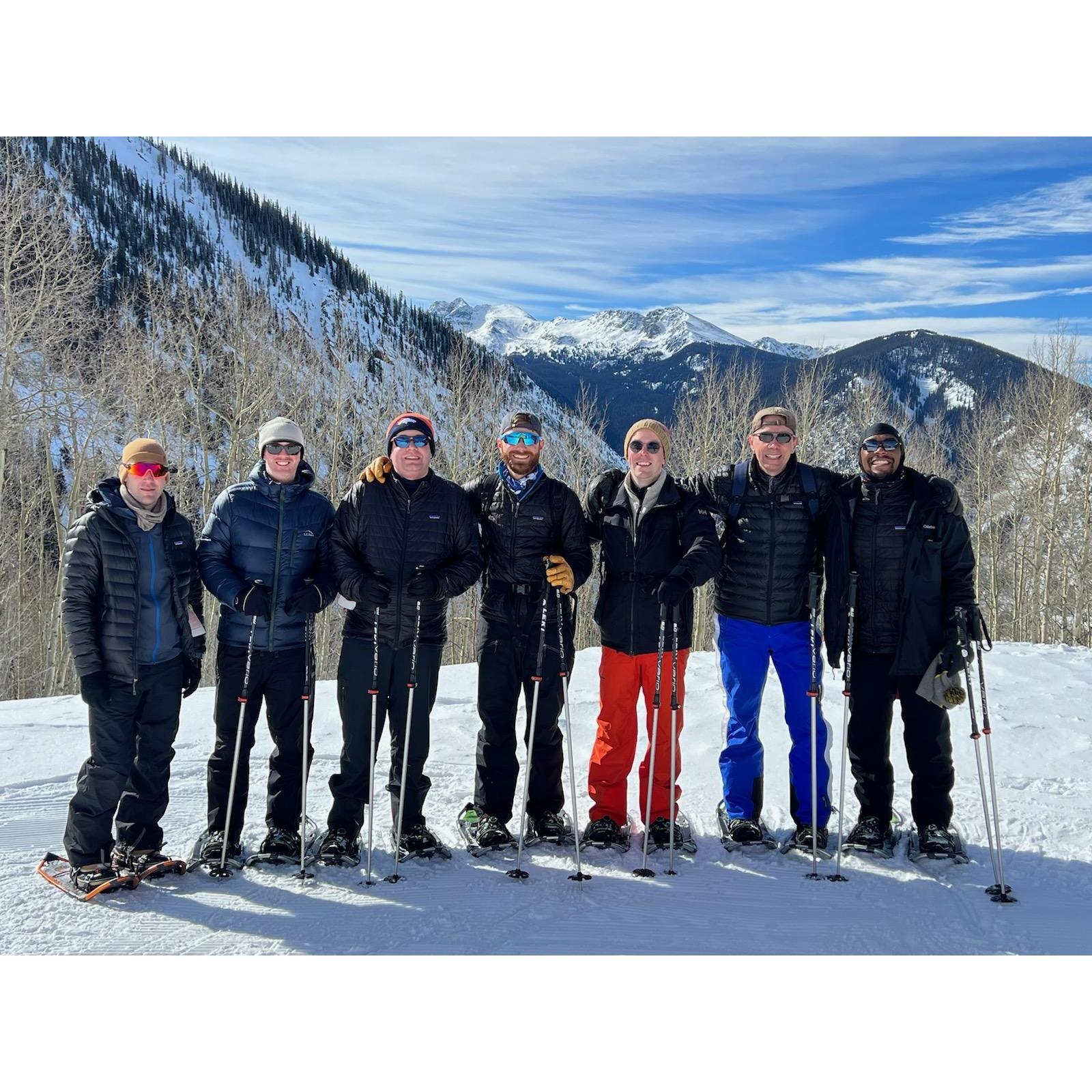 The groom's side of the wedding party snowshoeing at the bachelor party.