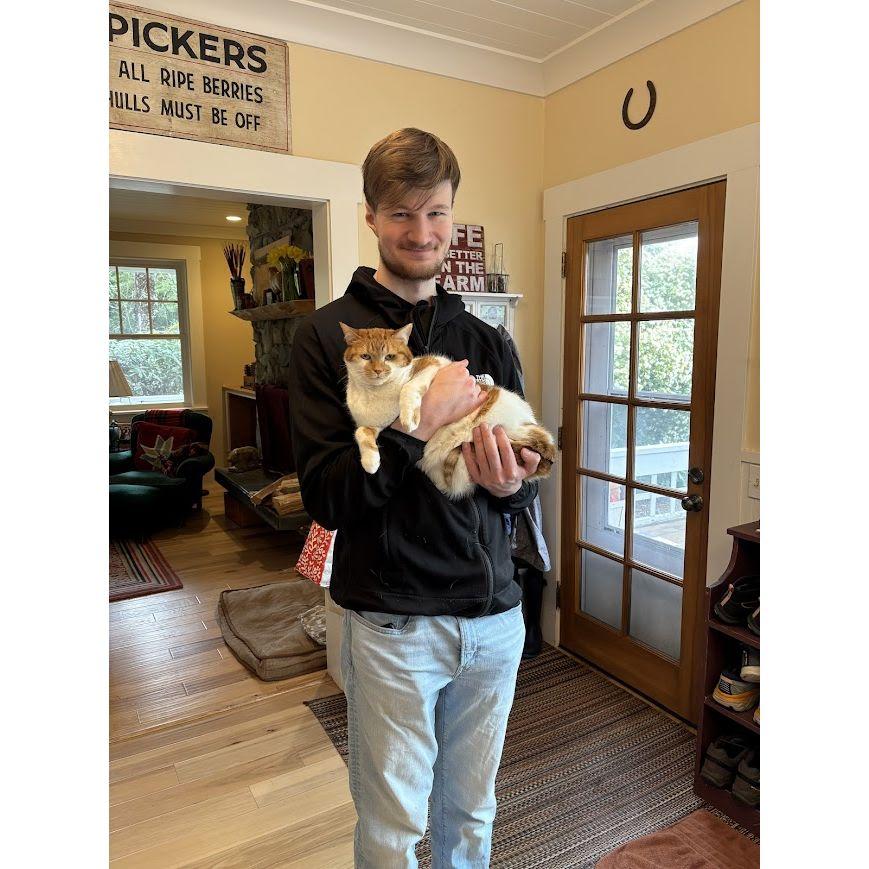 It is on the record that Ellie Lande is marrying a man who can't hold a cat properly.