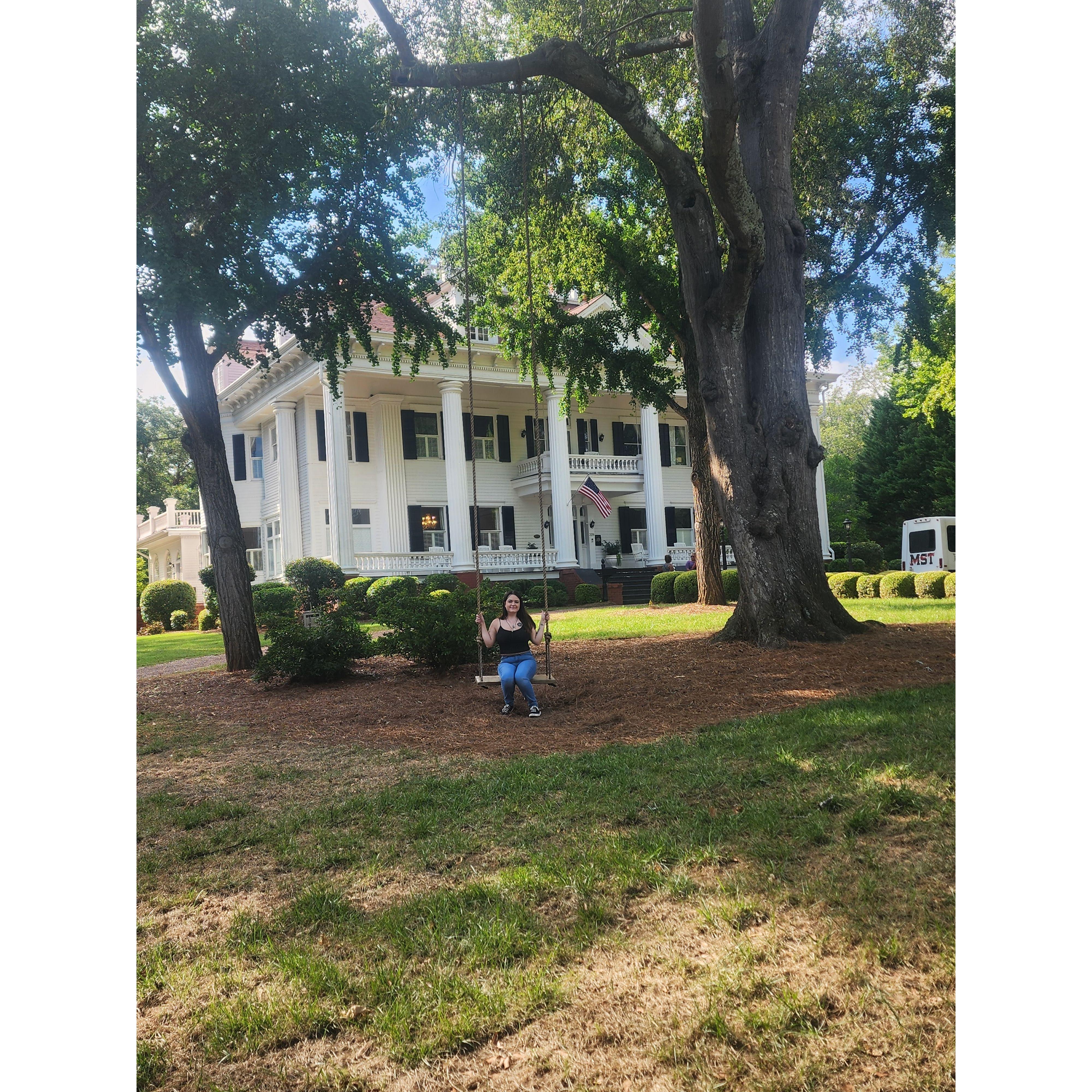 Elana Swinging in front of the 1864 Lockwood Mansion in Covington, Georgia