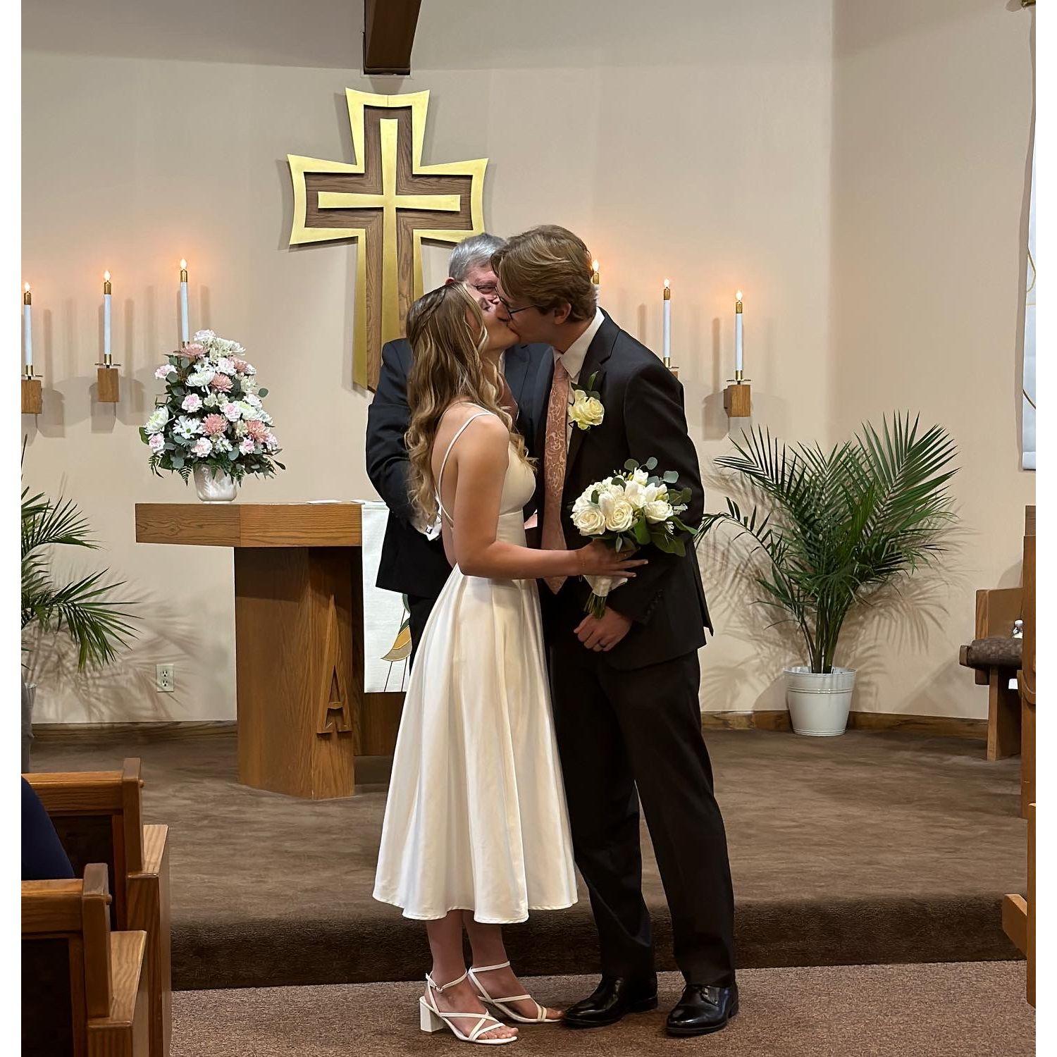 Our first kiss as husband and wife!