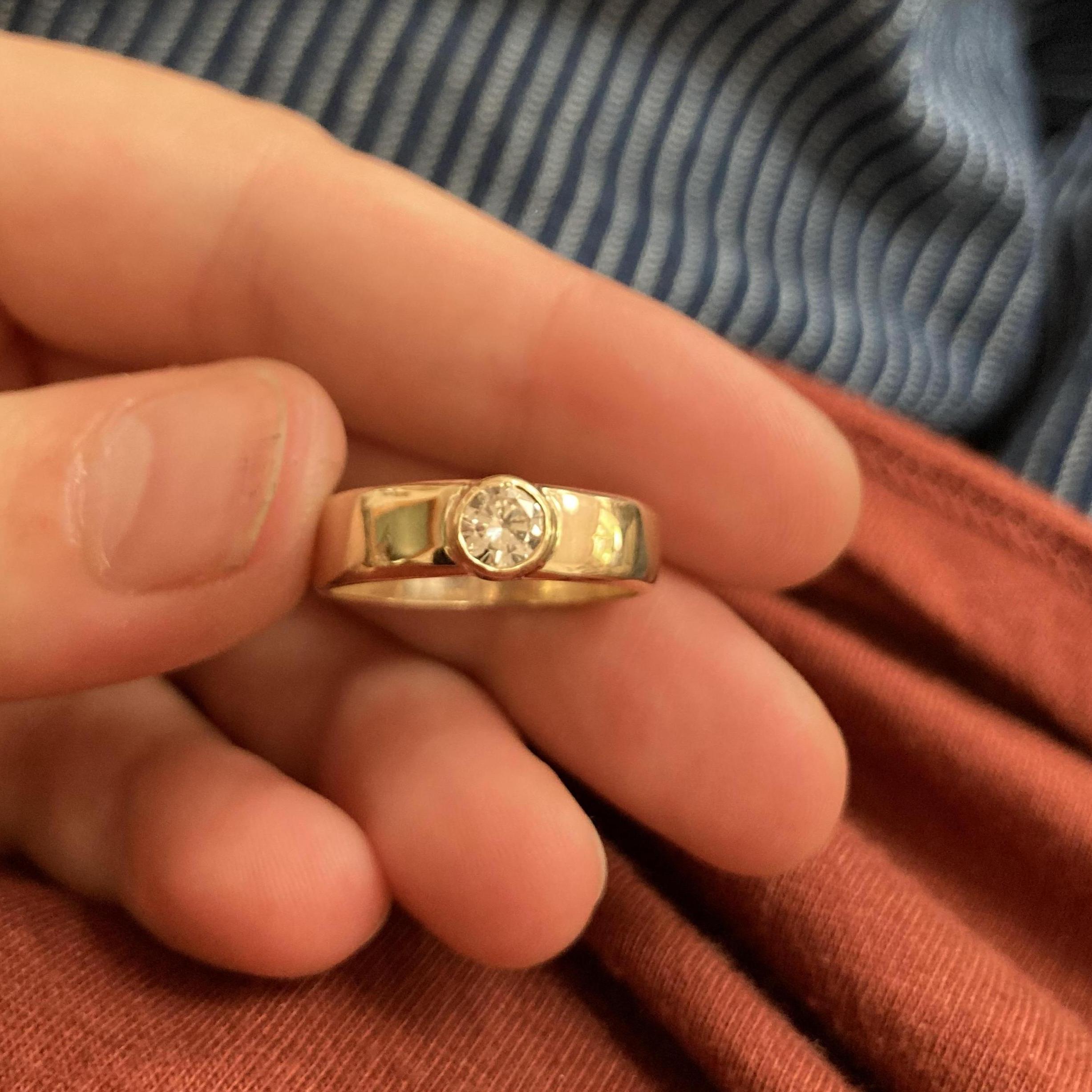 Ember recreated Travis's grandmothers engagement and wedding ring into a ring for Travis