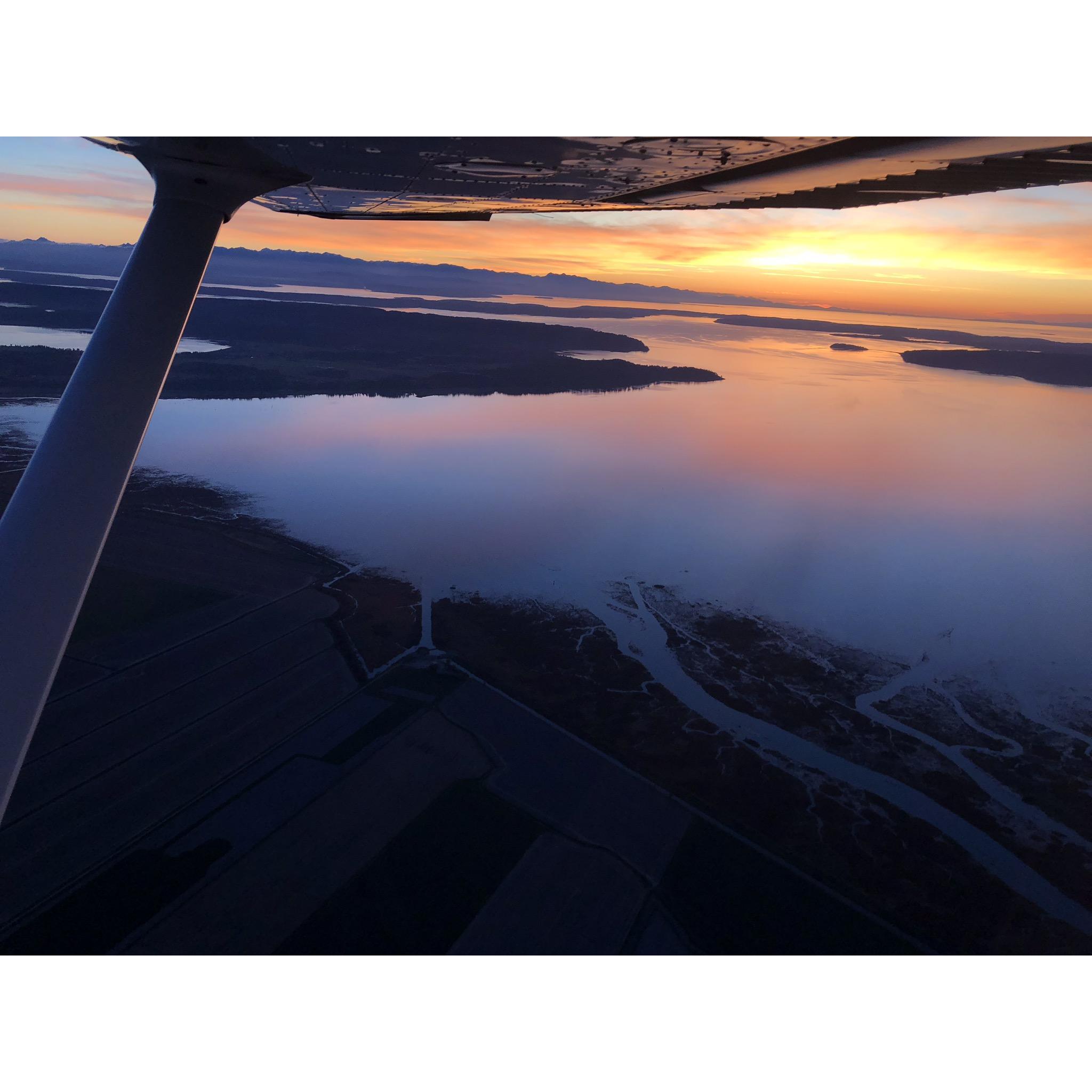 This epic sunset over the Puget Sound and Olympic Mountains was the backdrop to our first flight together. What a way to impress!