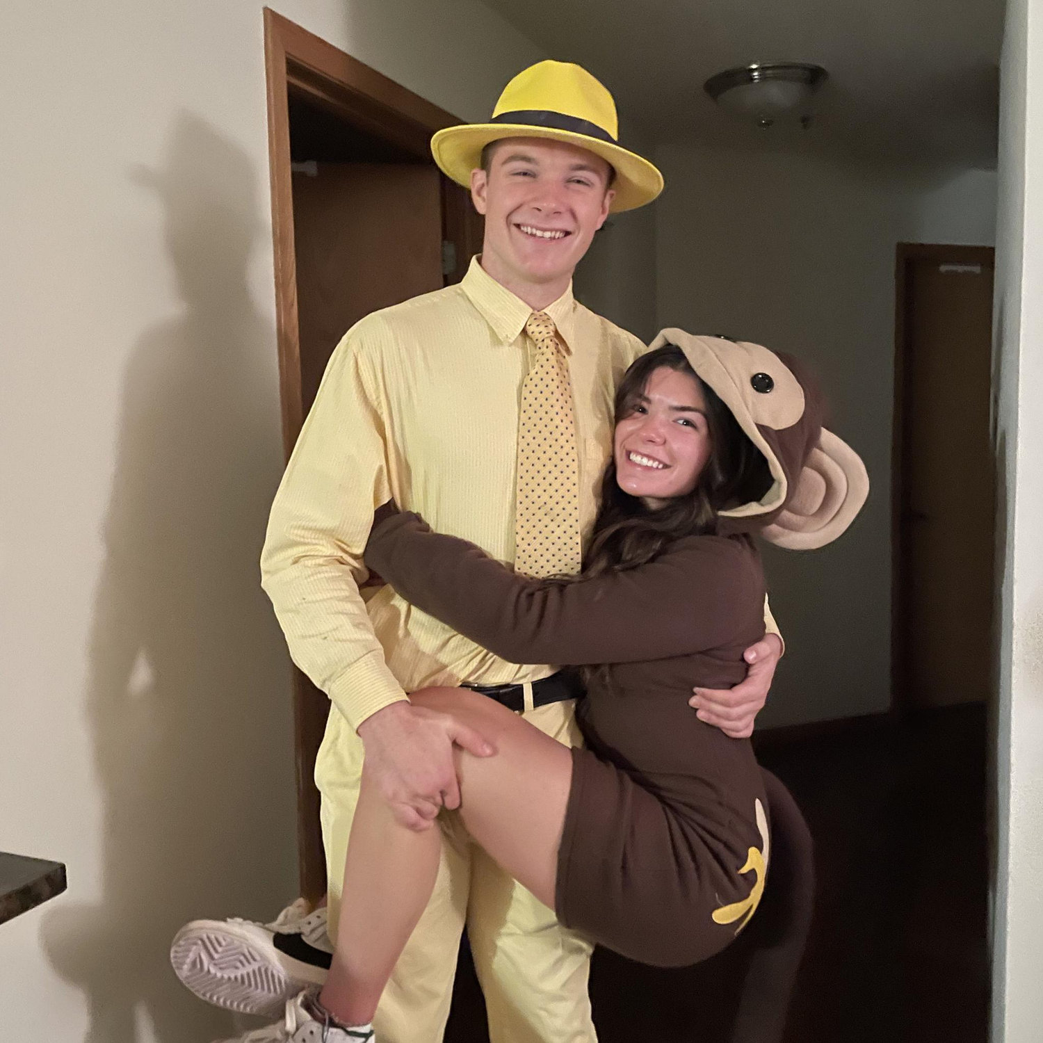 Dressed up as Curious George and the Man in the Yellow Hat for Halloween 2022
