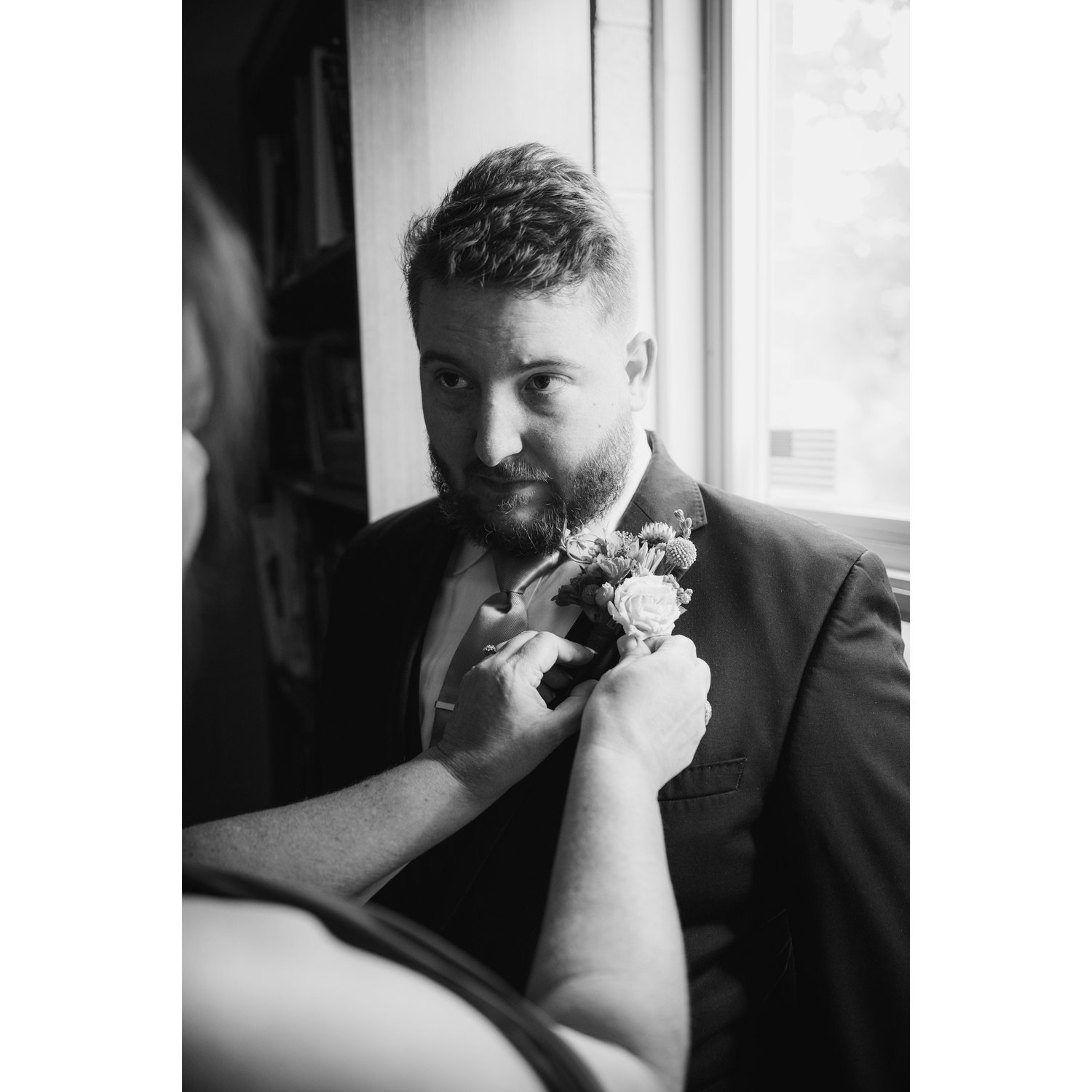 A mother getting her son ready for his wedding...
