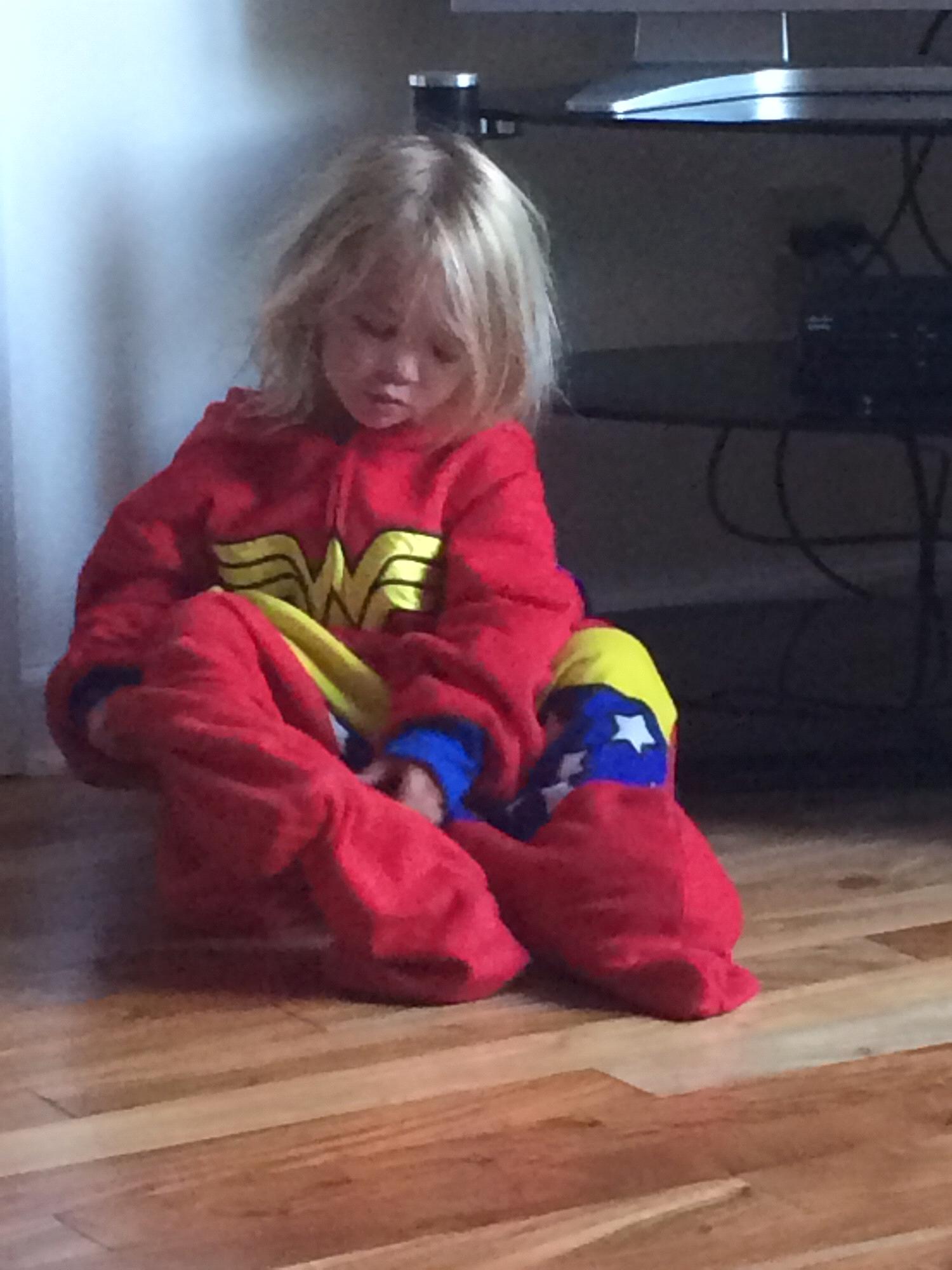 Hadley putting on Jill’s Superwoman outfit