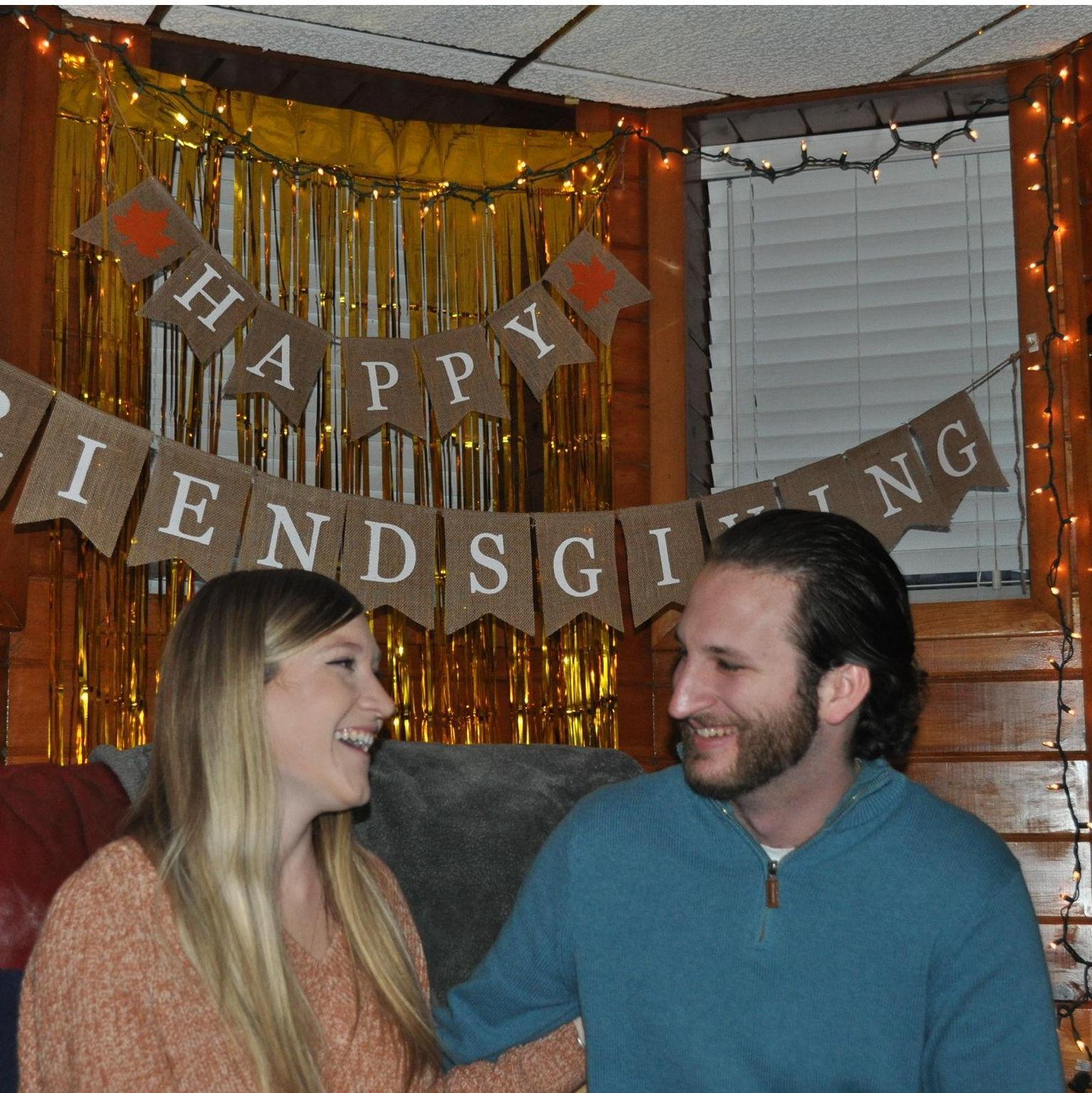 Caitlyn laughing at something stupid Anthony said during their Friendsgiving celebration in 2021.