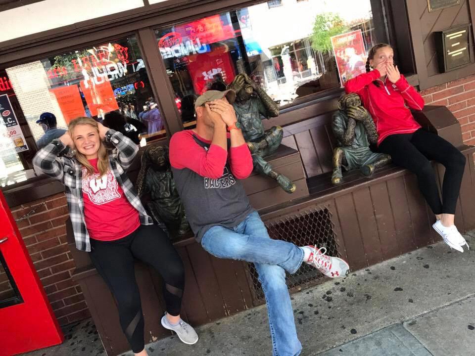 Scott , Mari and Makaley having fun on state street before a Badger football game.