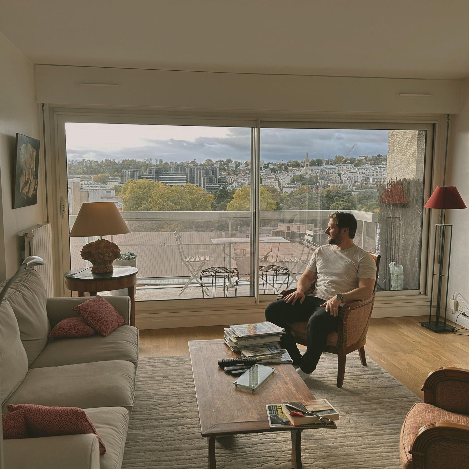 Nicholas first time in Paris, with Debbie. Testing out Robert’s sofa chair whilst looking at a pigeon.
