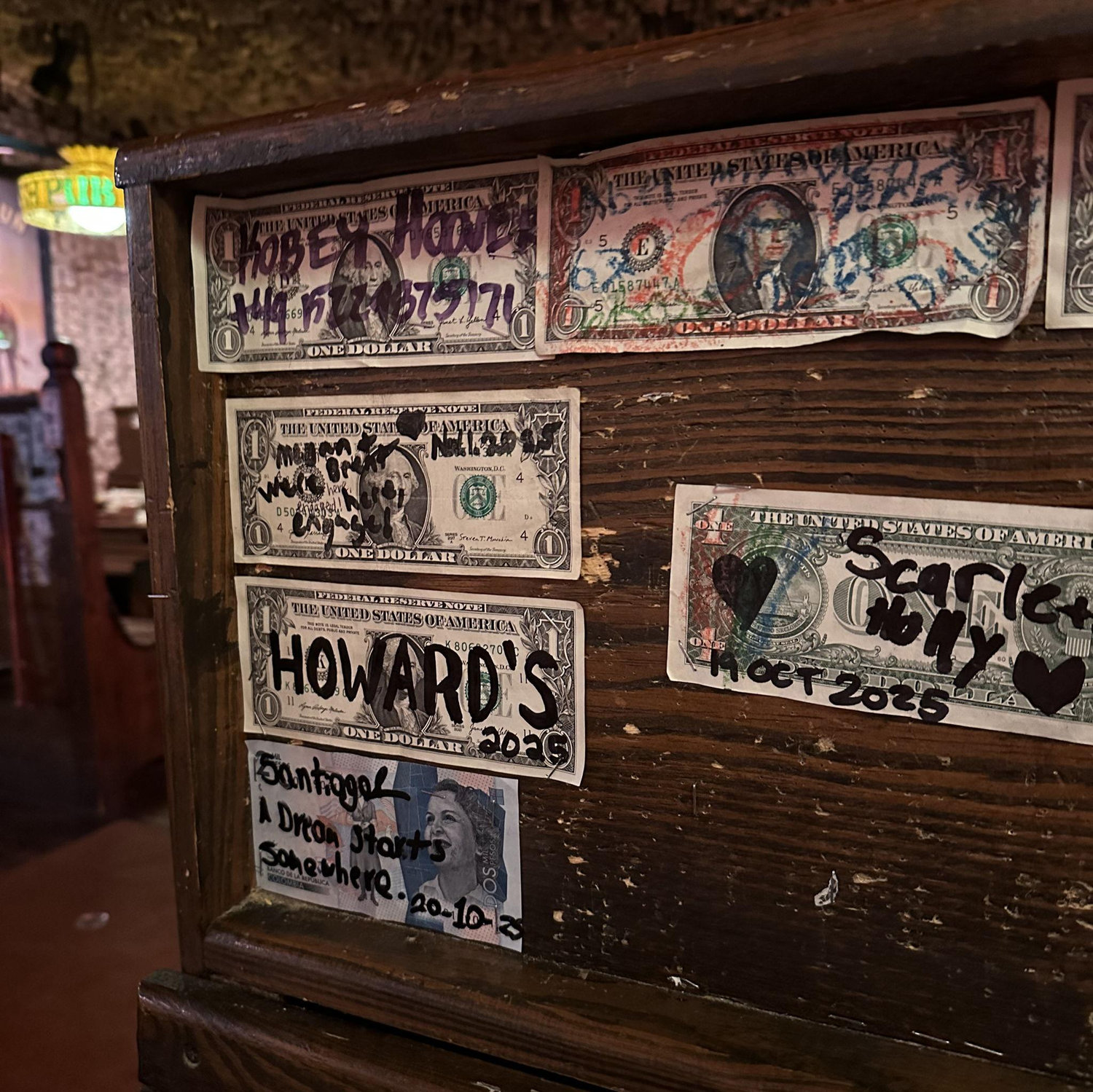 The dollar we stapled to the booth we were sat at in McGuire's Irish Pub for our "we were here" stamp as an engaged couple.