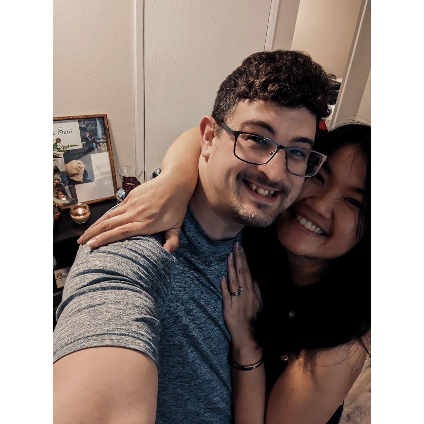 Our selfie with our engagement photo frame, which we both created together.
