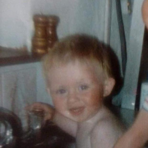 He's either really happy about the kitchen sink or he saw her