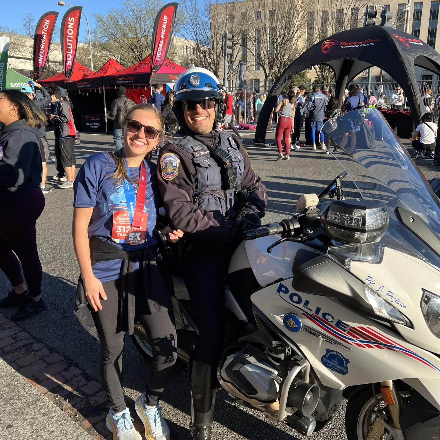 Maryann after running a 5k in D.C. and also visiting her favorite on duty police officer working the race!