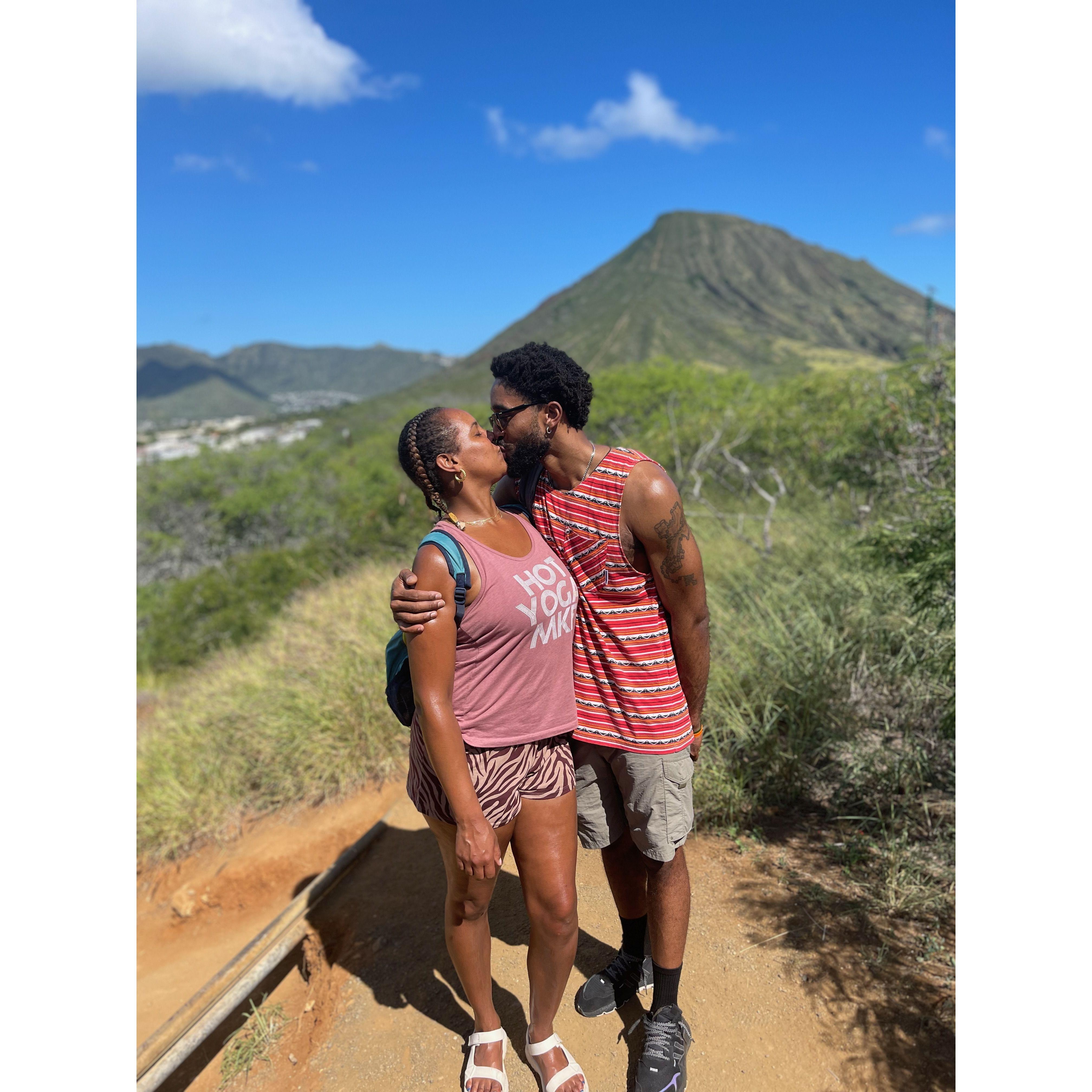 Smooching at the top of the Hanauma Bay Ridge Hike in Honolulu, Hawaii.