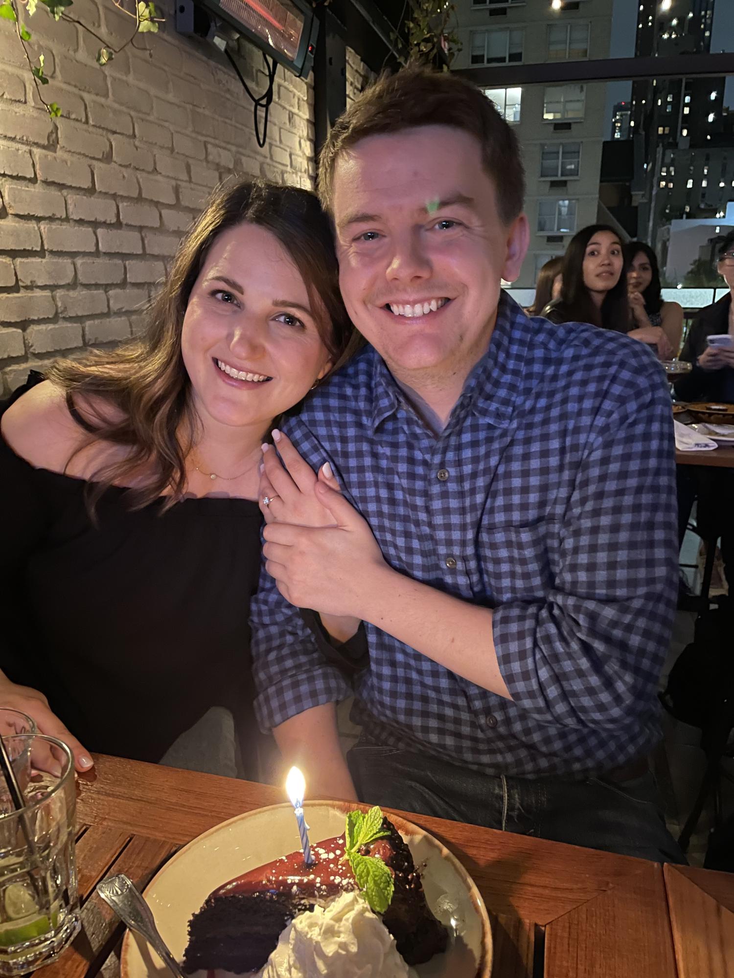 Showing off the ring during birthday celebrations.