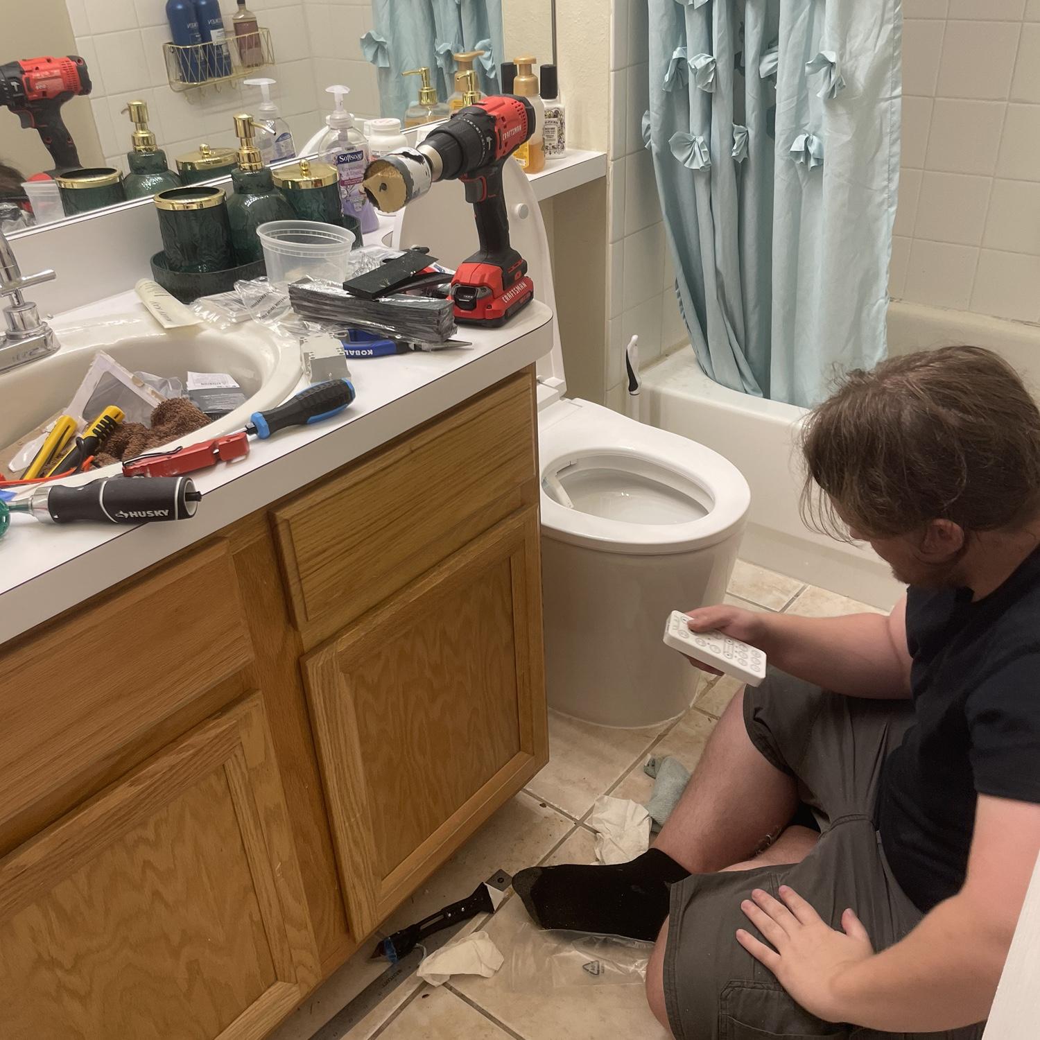 Hard at work replacing toilets.