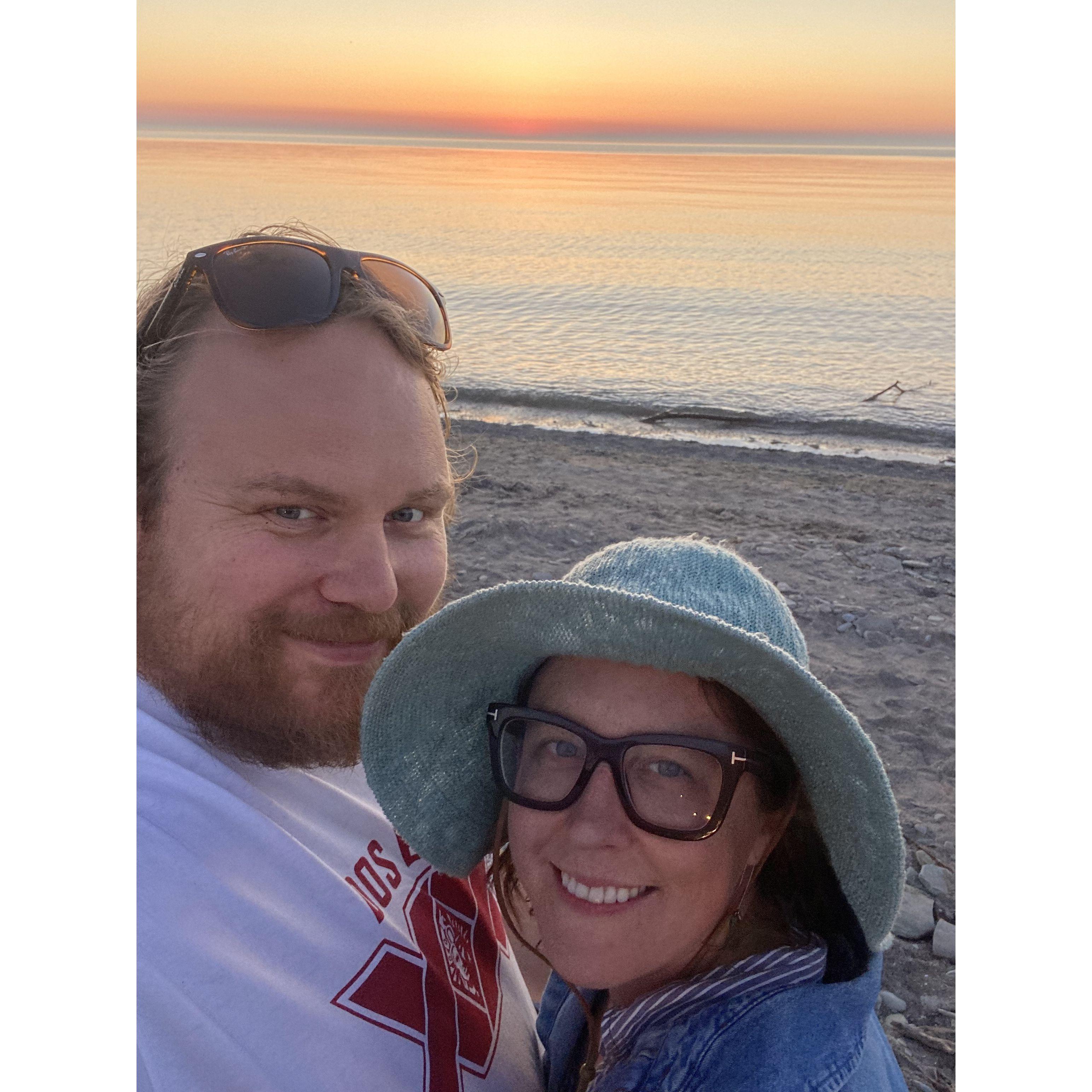 Us enjoying one of the many beautiful Lake Erie sunsets at our beach!
